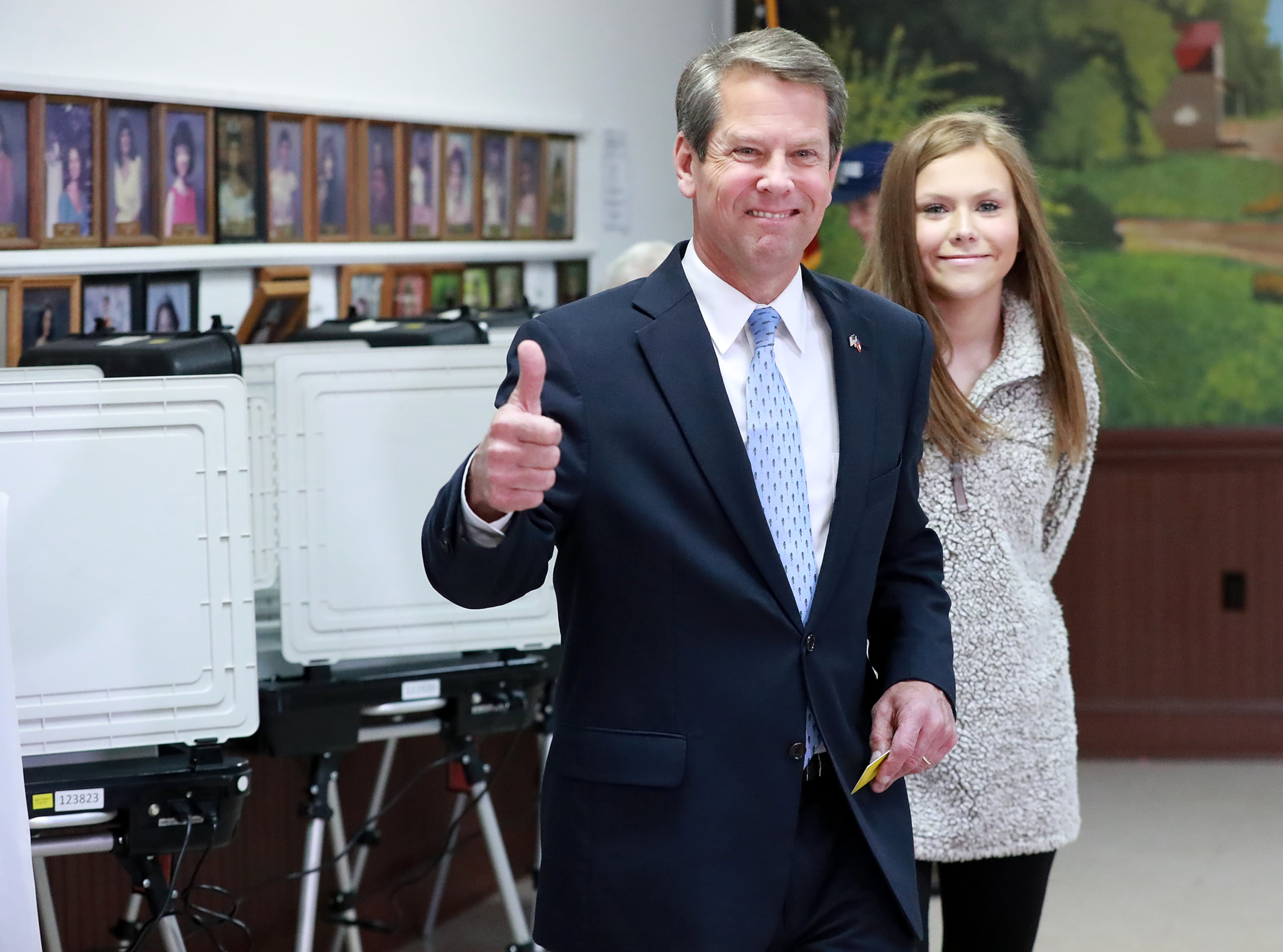Nov 6, 2018 Winterville: Secretary of State Brian Kemp, Republican candidate for Georgia governor, gives the thumbs up while voting at the Winterville Train Depot with his daughter Amy Porter and other family members on Tuesday, Nov. 6, 2018, in Winterville. Curtis Compton/ccompton@ajc.com