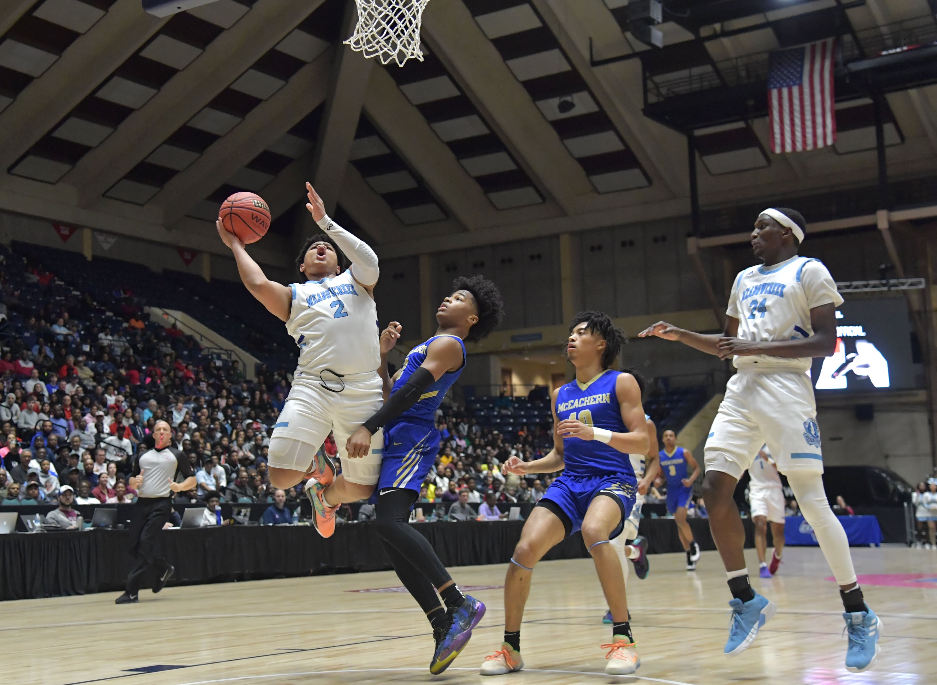 March 9, 2019 Macon - Meadowcreek Kedric Green (2) shoots against McEachern Sharife Cooper (2) in GHSA State Basketball Championship game at the Macon Centreplex in Macon on Saturday, March 9, 2019. HYOSUB SHIN / HSHIN@AJC.COM