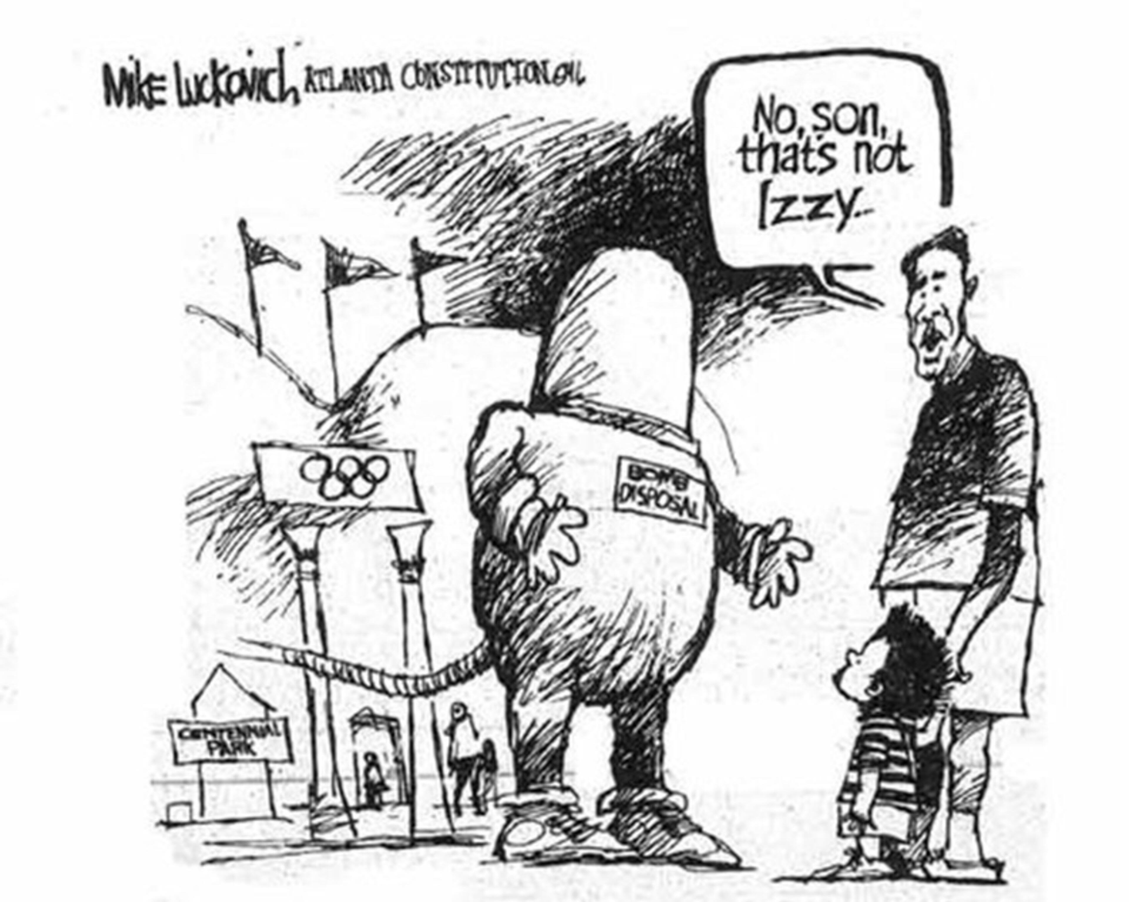 July 1996: A father tells his son that the man wearing a bomb disposal suit is not Izzy, the Atlanta Games mascot.