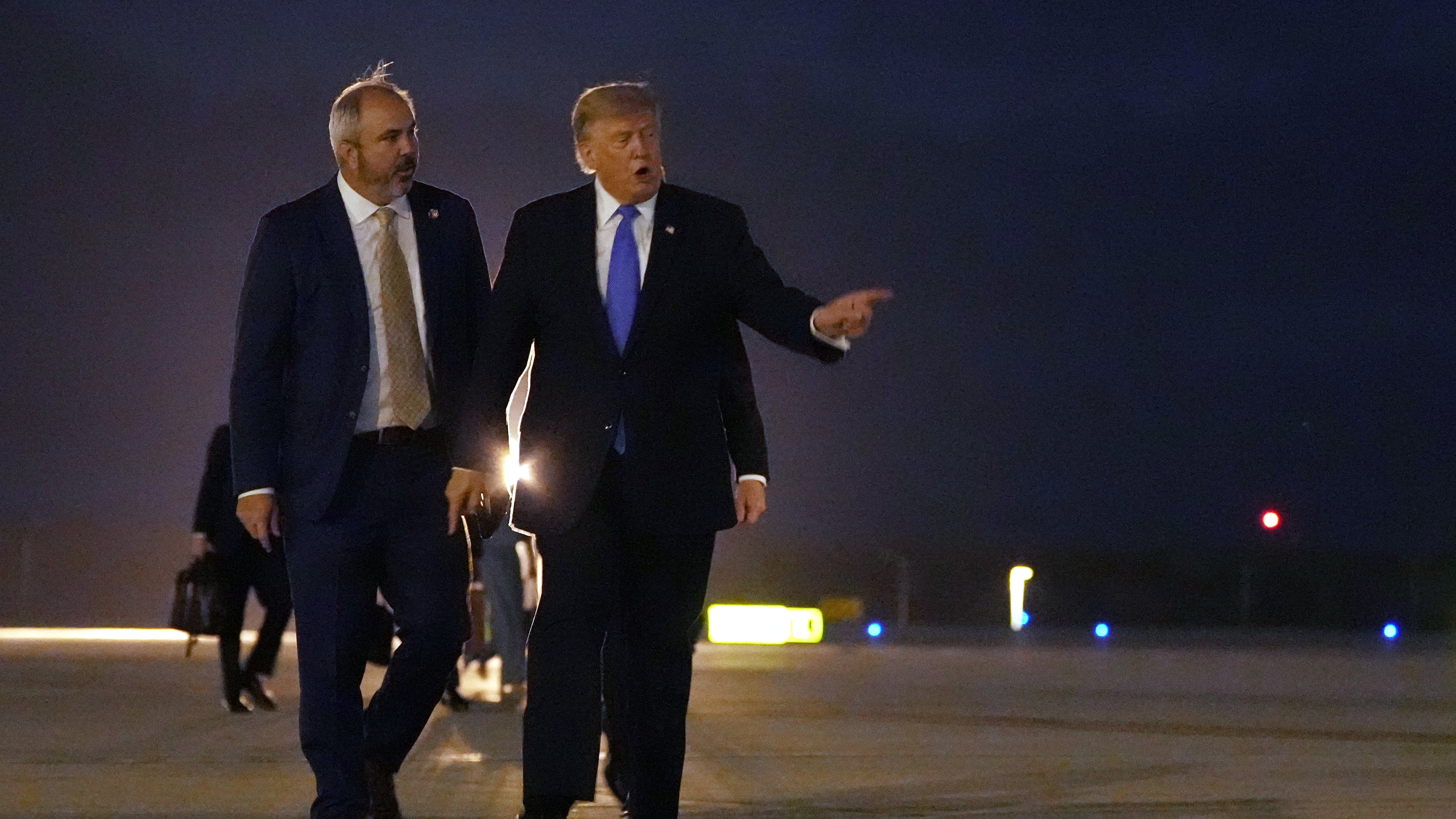 President Donald Trump walks to board Air Force One, Tuesday, Aug. 4, 2026, at Los Angeles International Airport in Los Angeles. (AP Photo/Mark Schiefelbein)