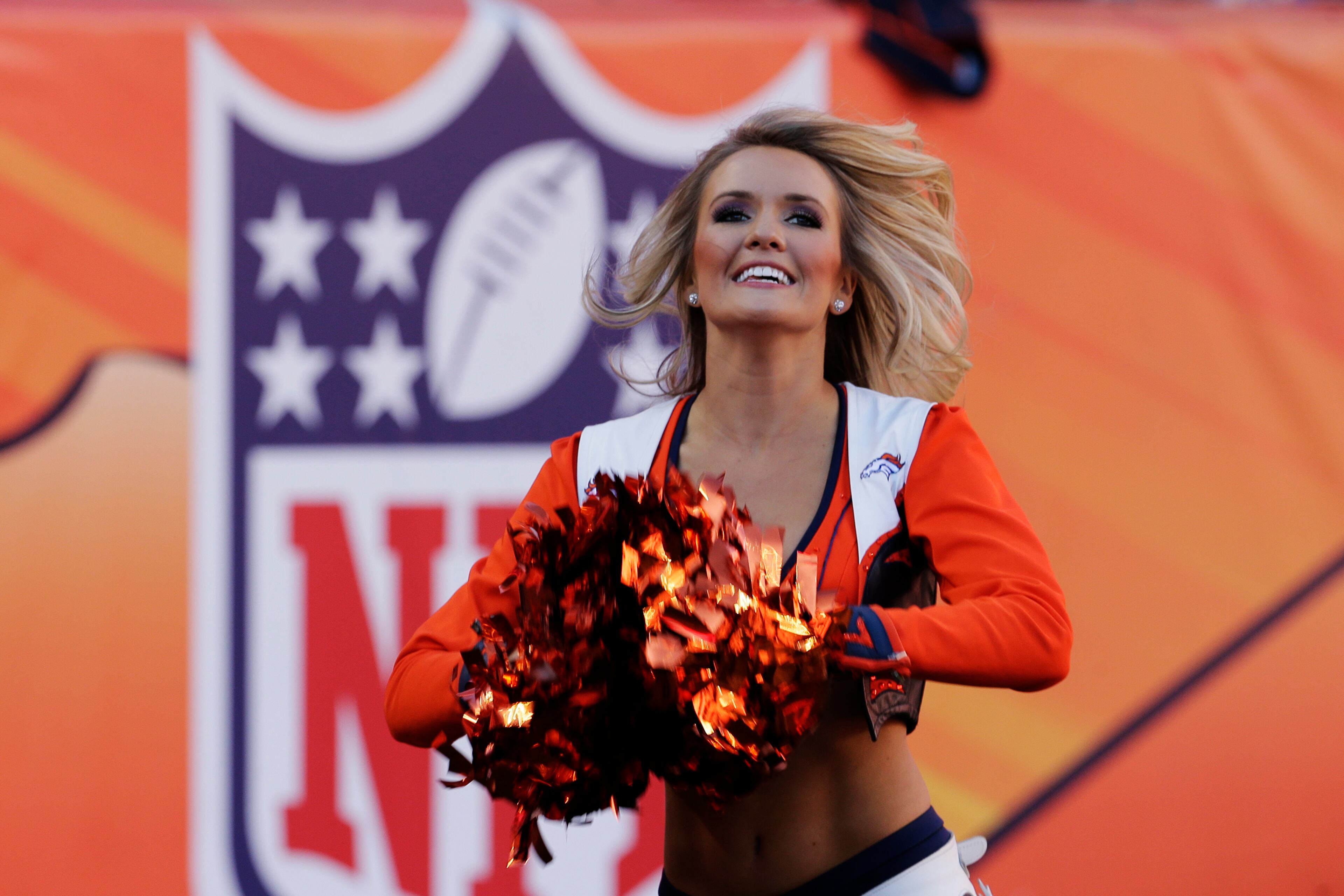 A Denver Broncos cheerleader performs during the second half of the AFC Championship NFL playoff football game in Denver on Jan. 19, 2014.