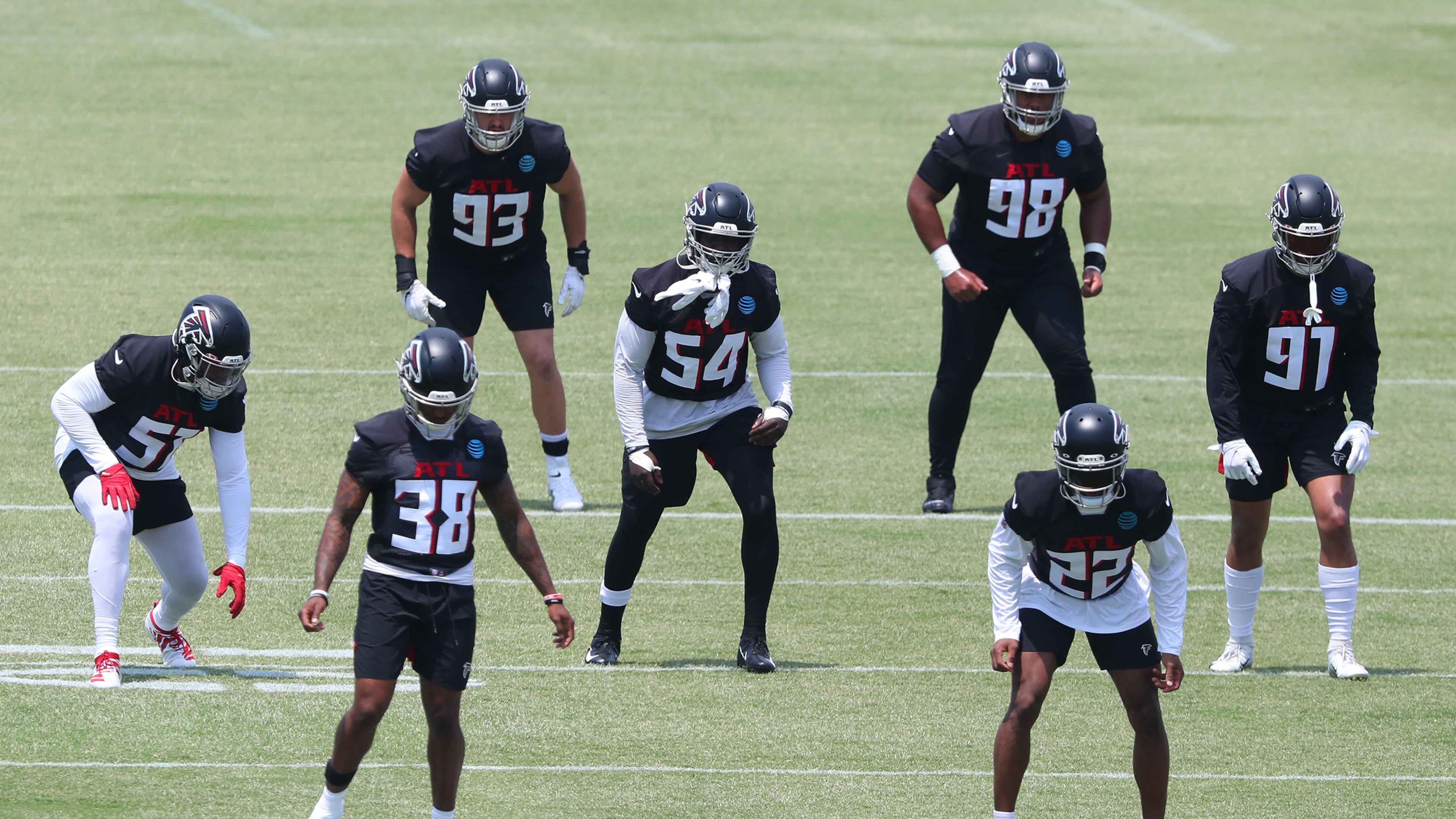 Eli Ankou (98) with several Falcons defenders during OTAs at the team training facility on Tuesday, May 25, 2021, in Flowery Branch. (Curtis Compton/AJC file photo)