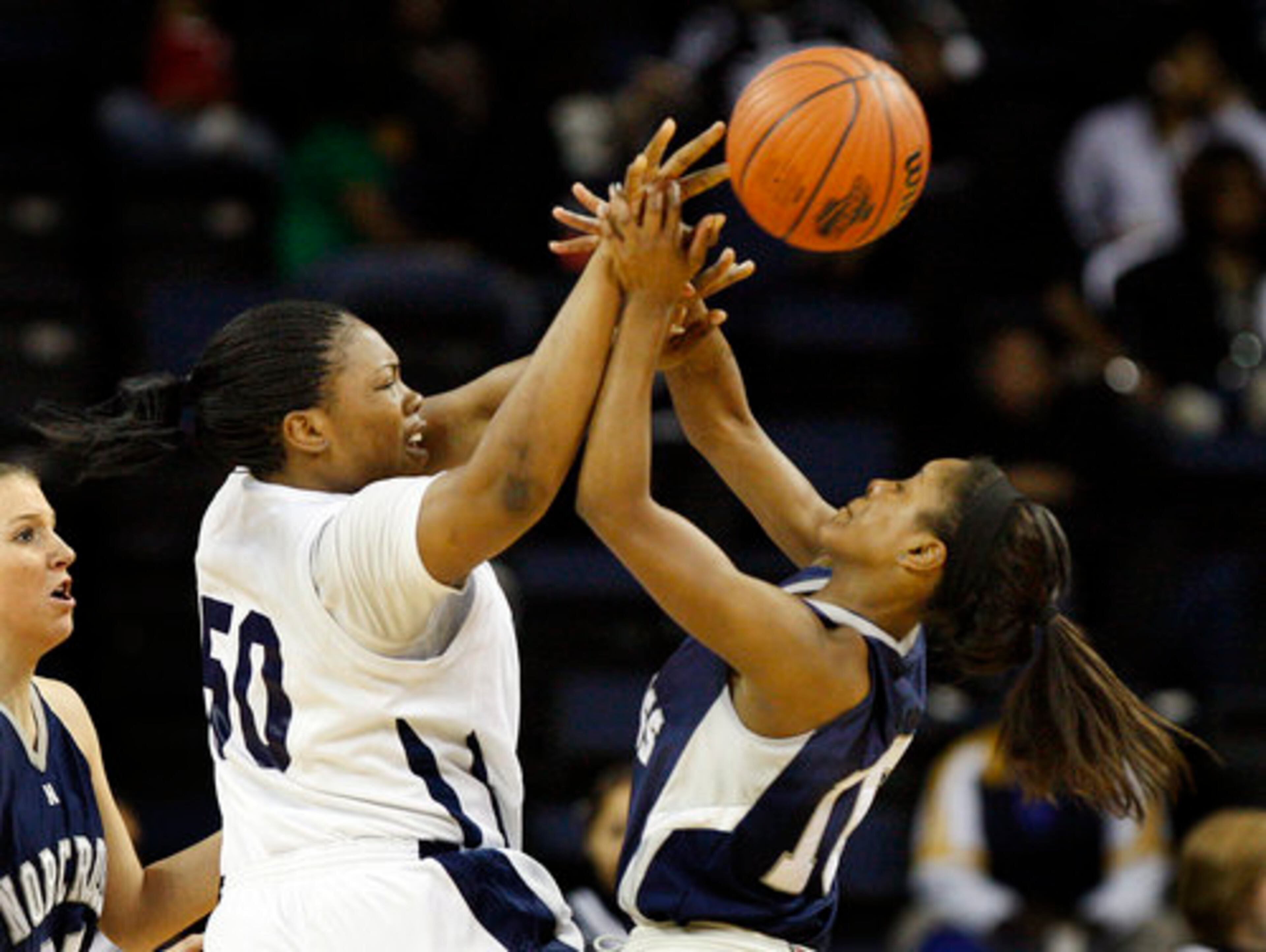 Redan Raiders # 50 Aneesah Daniels, left, and Norcross Blue Devils # 10 Briana Jordan, right, battle for the ball during 1st half action in their Class AAAAA Girls GHSA State Basketball Championship in Duluth on Friday, March 12, 2010.