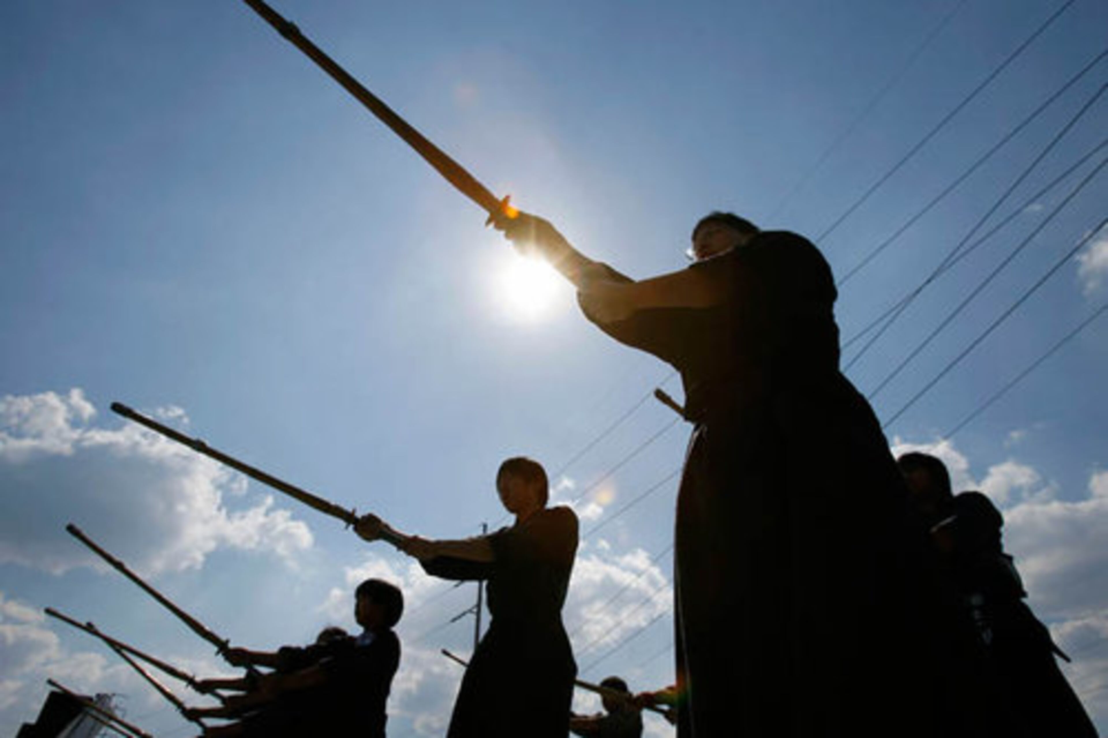 Members of the Atlanta Kumdo Academy Il Kum Kwon demonstrate the sport of fencing with bamboo swords.