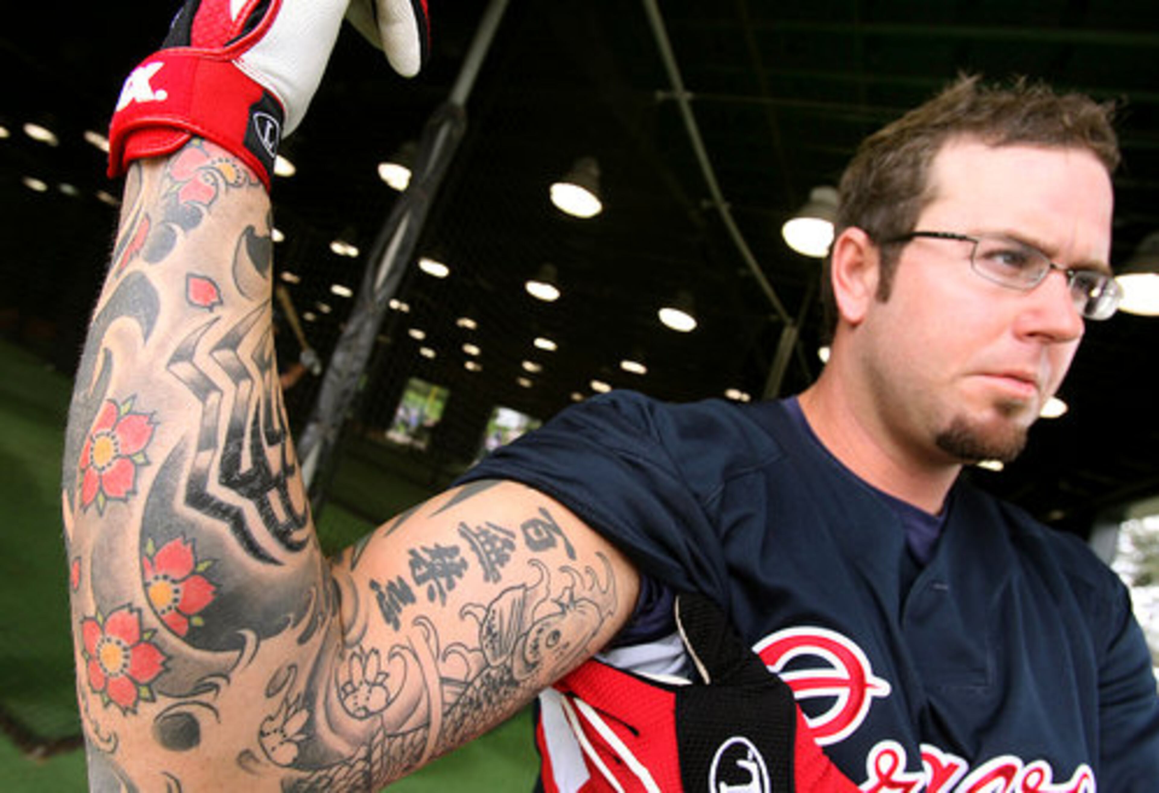 Australian sidewinder Peter Moylan shows off his tattoo.
