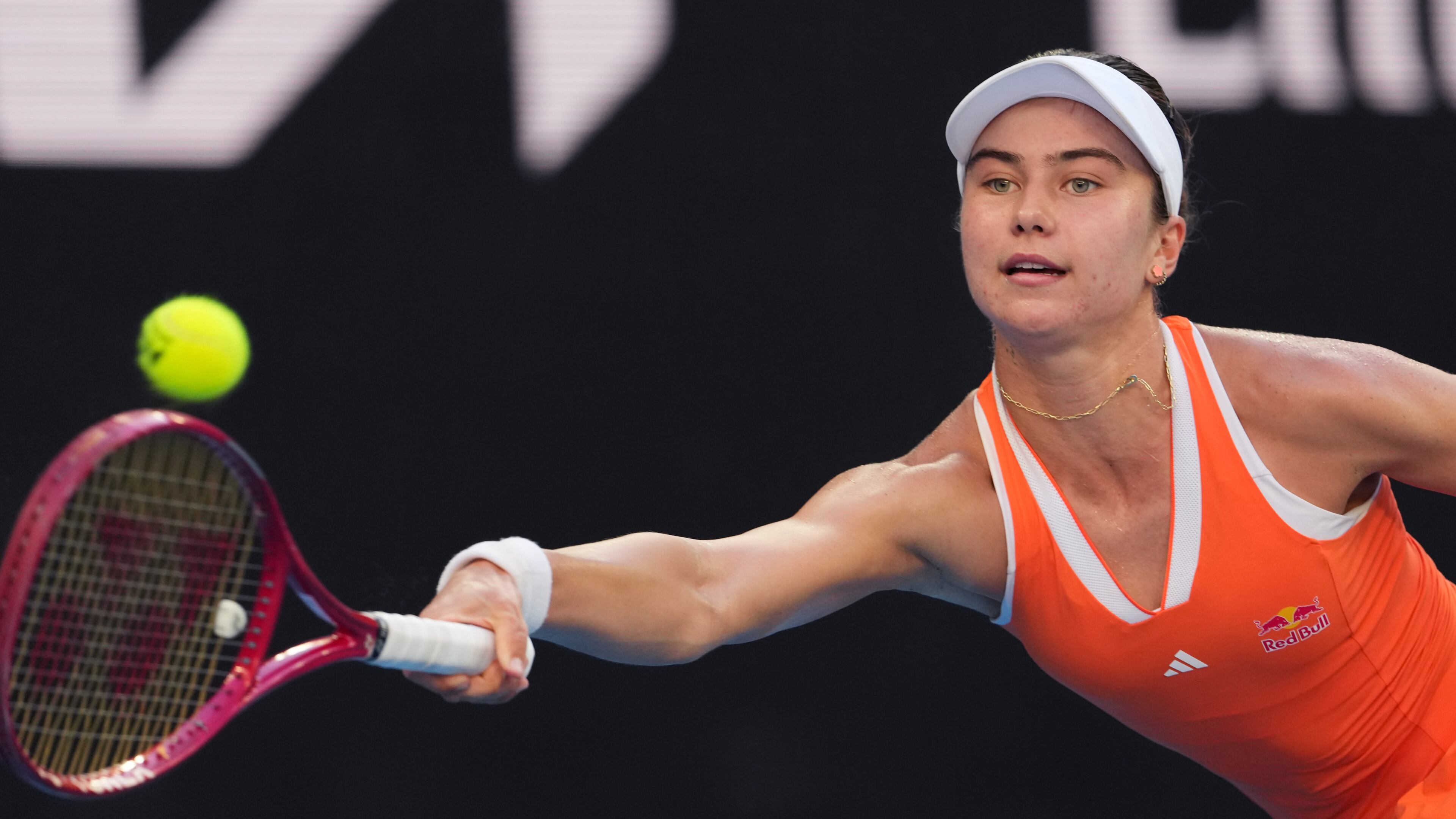 Iva Jovic of the U.S. plays a forehand return to Jasmine Paolini of Italy during their third round match at the Australian Open tennis championship in Melbourne, Australia, Friday, Jan. 23, 2026. (AP Photo/Aaron Favila)