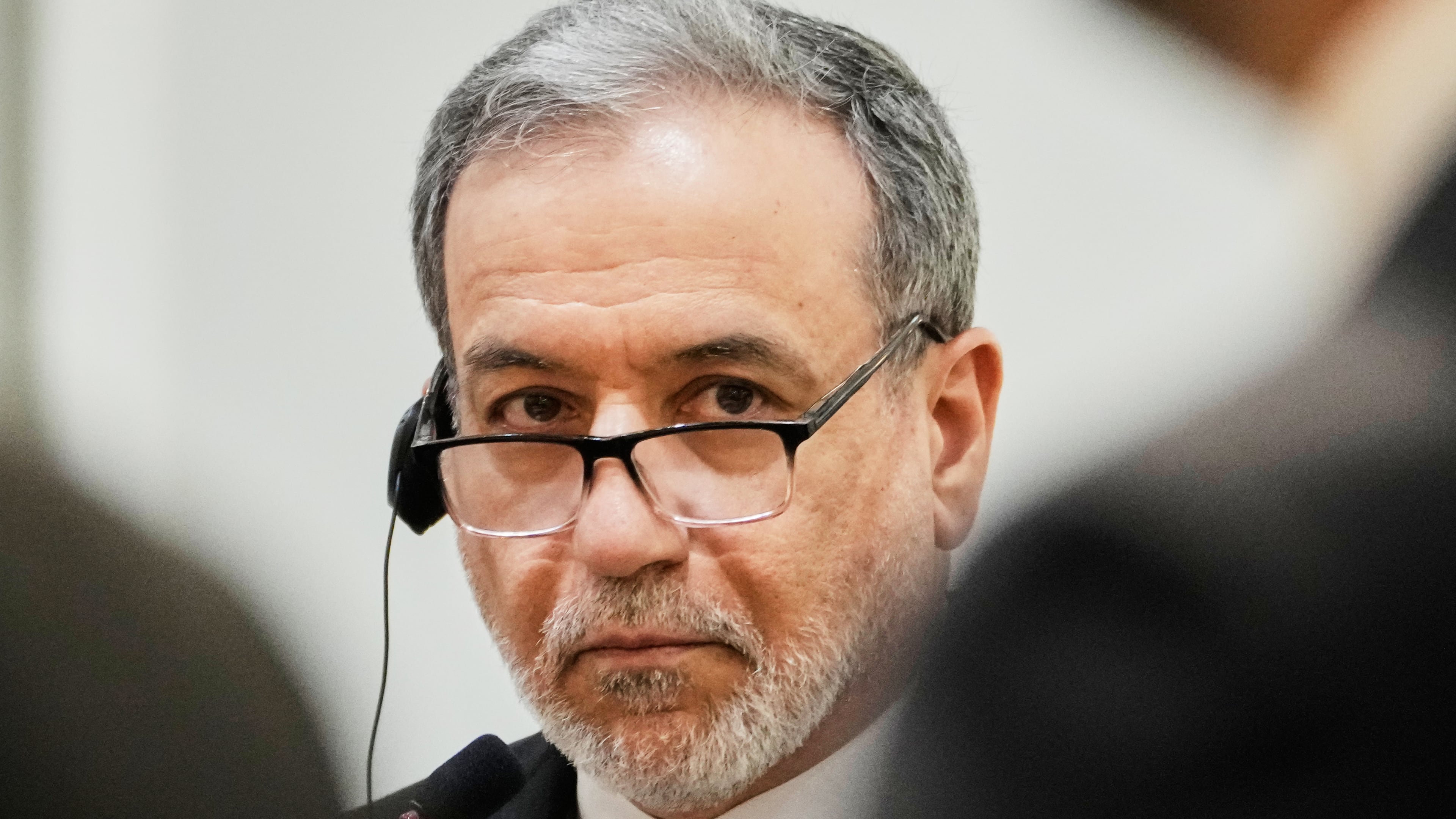 Iranian Foreign Minister Abbas Araghchi listens to his Iraqi counterpart Fouad Hussein during a news conference after a meeting at the foreign ministry in Baghdad, Iraq, Sunday, June 28, 2026. (AP Photo/Hadi Mizban)