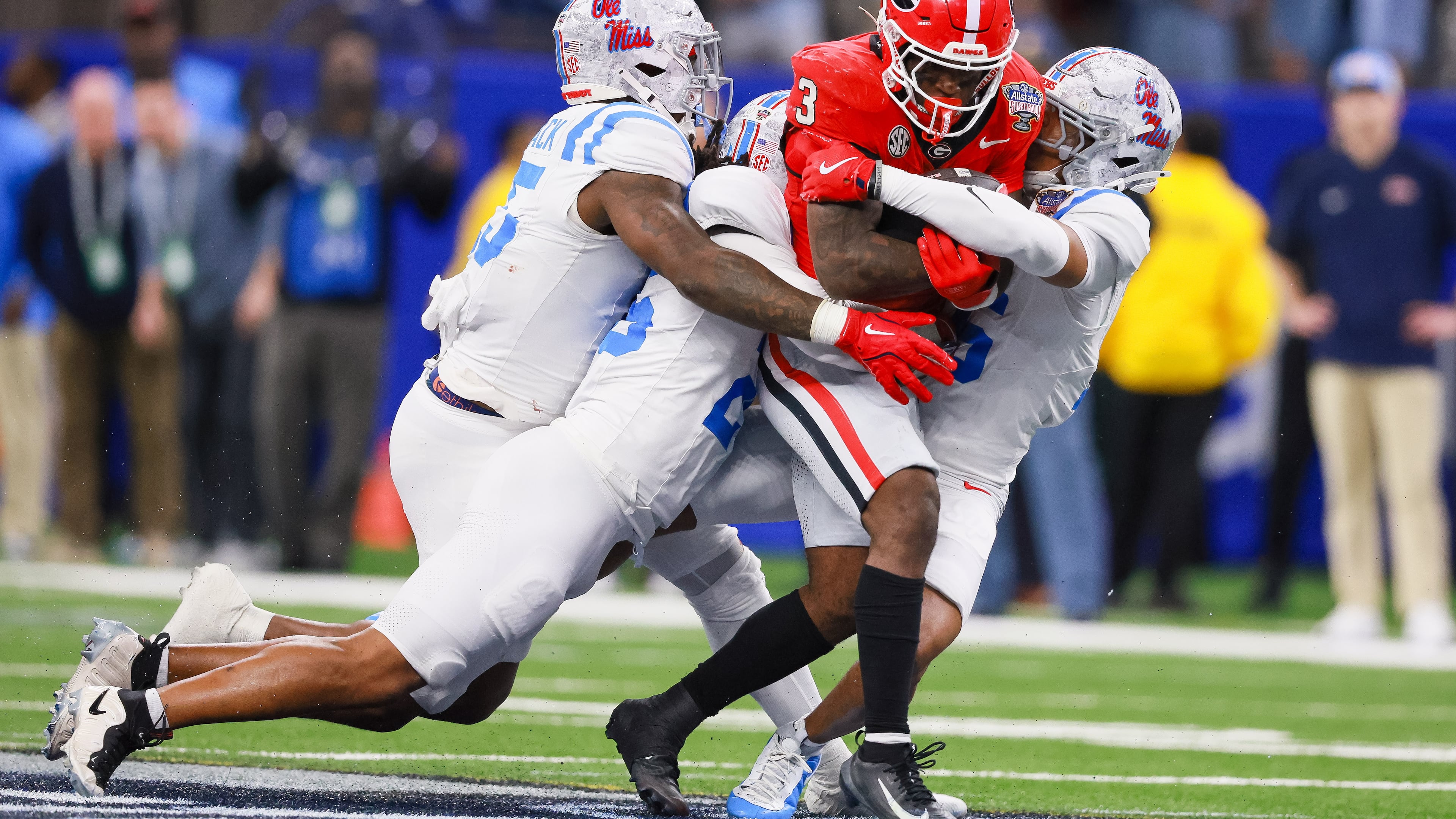 Georgia Bulldogs running back Nate Frazier runs for a first down against the Ole Miss Rebels defense during the fourth quarter of the NCAA College Football Playoff quarterfinal game at the Sugar Bowl in the Caesars Superdome, Thursday, Jan. 1, 2026, in New Orleans. (Jason Getz/AJC)