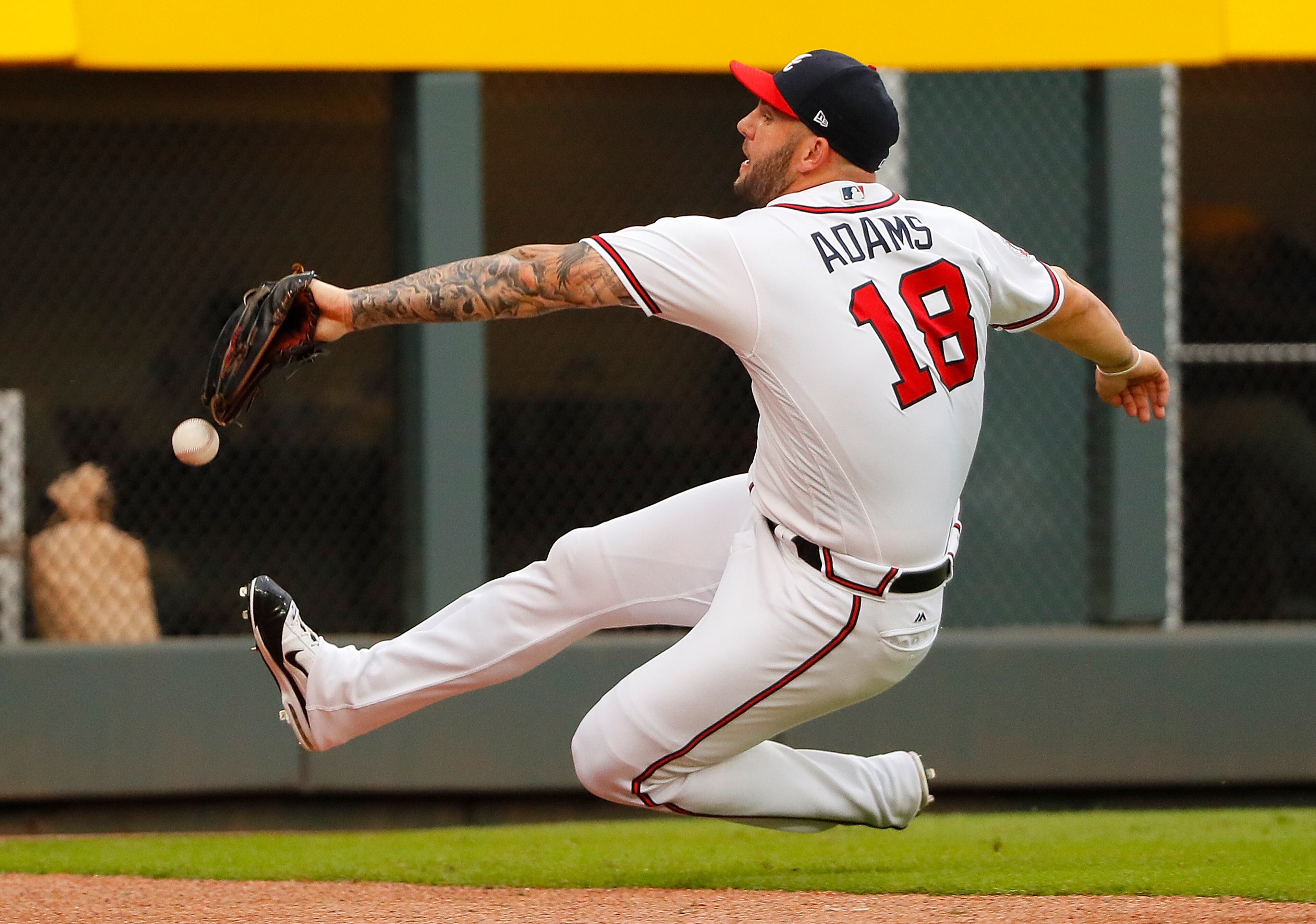 ATLANTA, GA - AUGUST 08: Matt Adams #18 of the Atlanta Braves fails to catch this double hit by Cesar Hernandez #16 of the Philadelphia Phillies to lead off the first inning at SunTrust Park on August 8, 2017 in Atlanta, Georgia. (Photo by Kevin C. Cox/Getty Images)