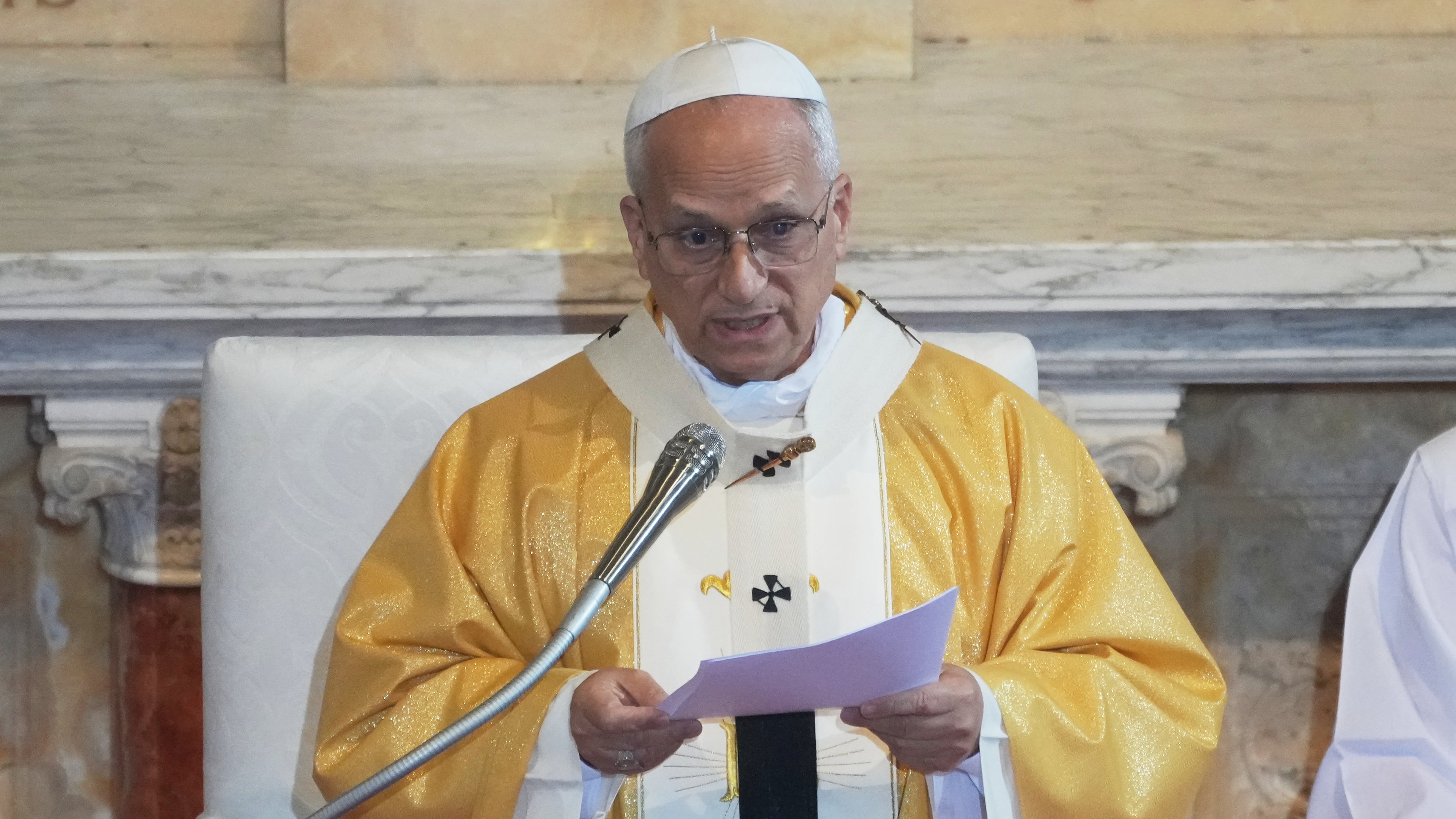 Pope Leo XIV delivers his speech as he celebrates a Mass in the Saint Augustine Basilica in Annaba, Algeria, Tuesday, April 14, 2026, on the second day of an 11-day apostolic journey to Africa. (AP Photo/Andrew Medichini)