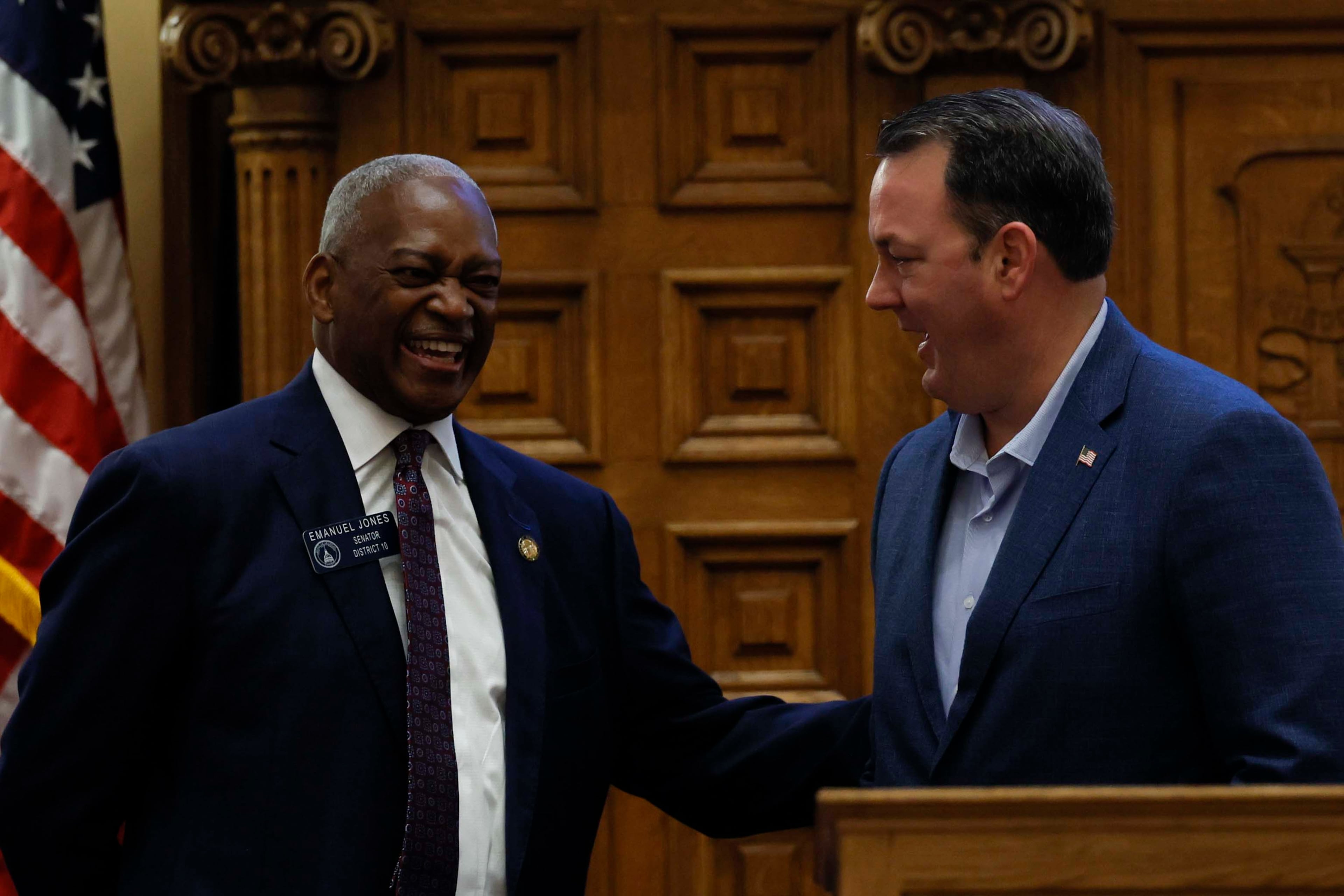 State Sen. Emanuel Jones (left) and Lt. Gov. Burt Jones share a laugh at the state Capitol last month. (Miguel Martinez/AJC)