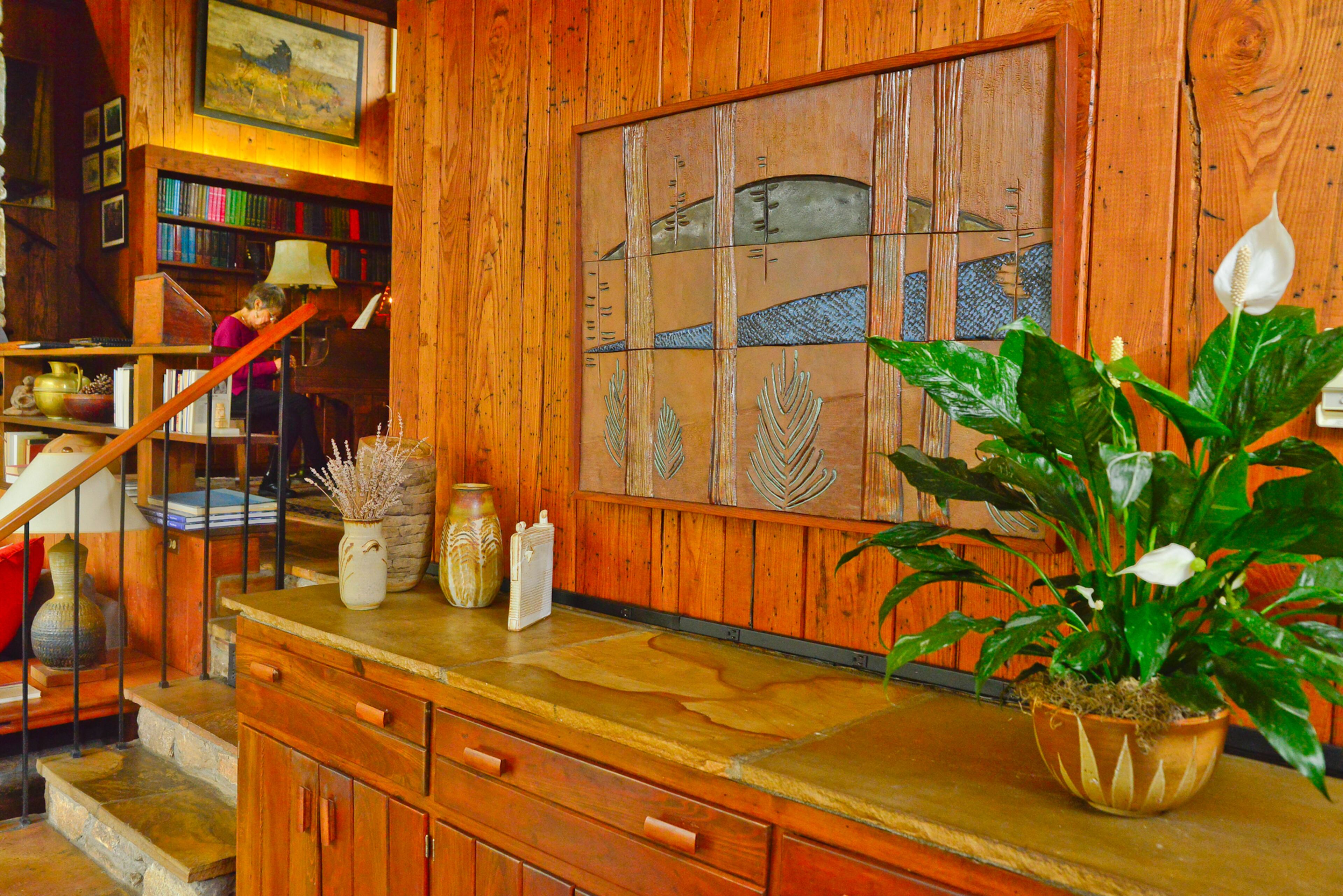 Original and local art, as well as music, fills the Druid Hills home. A ceramic wallhanging by Robert Westervelt, formerly with Agnes Scott College and now living in Gainesville, depicts Stone Mountain from three perspectives as you ascend the mountain.