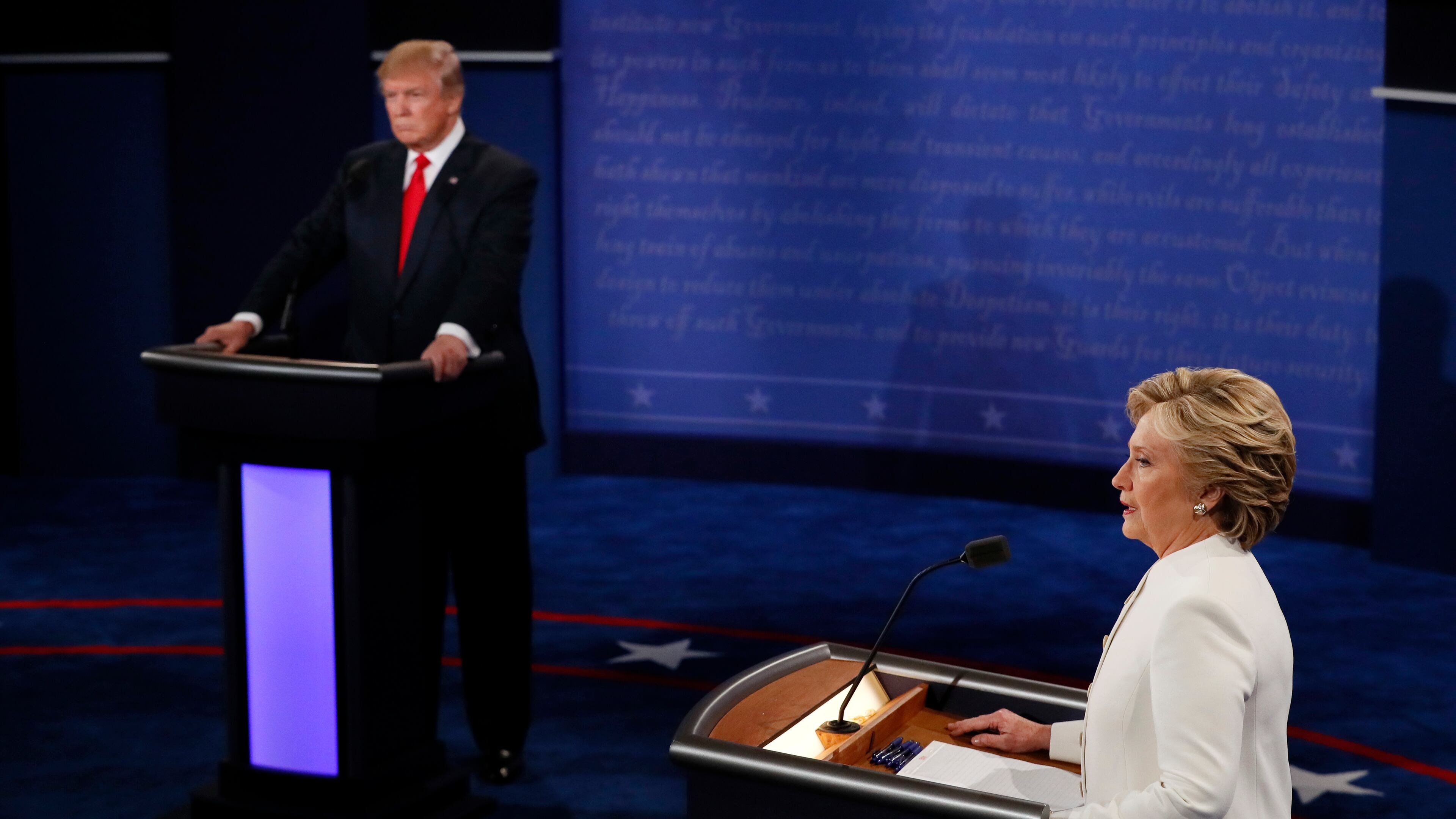 Democratic presidential nominee Hillary Clinton speaks as Republican presidential nominee Donald Trump listens during the third presidential debate at UNLV in Las Vegas, Wednesday, Oct. 19, 2016. (Mark Ralston/Pool via AP)