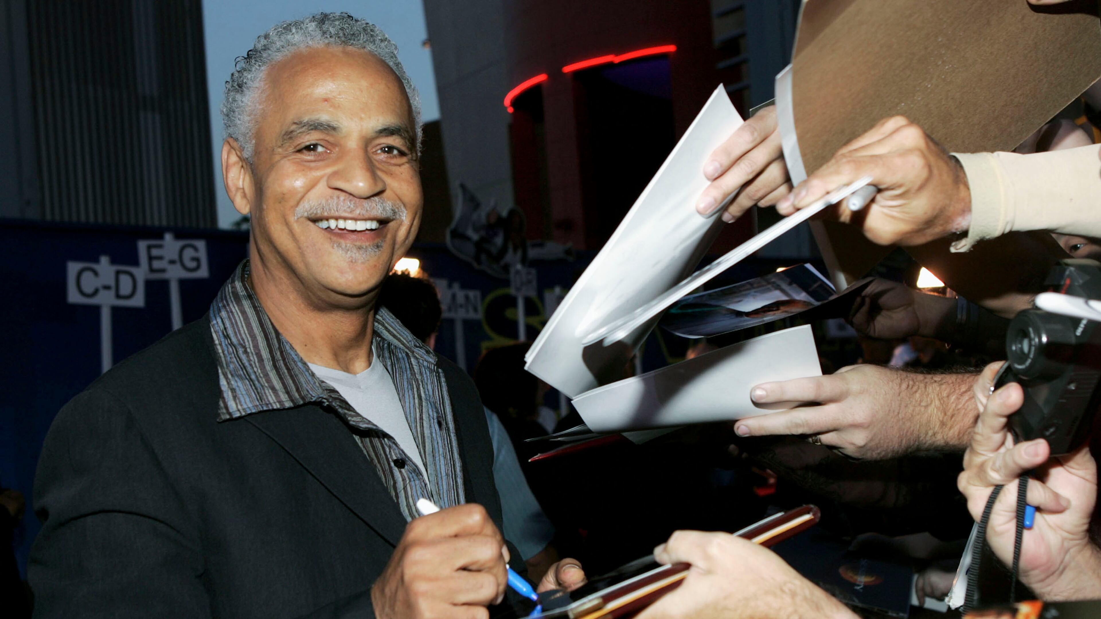 Actor Ron Glass signs autographs at the Universal Pictures' Premiere of 'Serenity' held at Universal Studios on September 22, 2005 in Los Angeles, California. (Photo by Frazer Harrison/Getty Images)