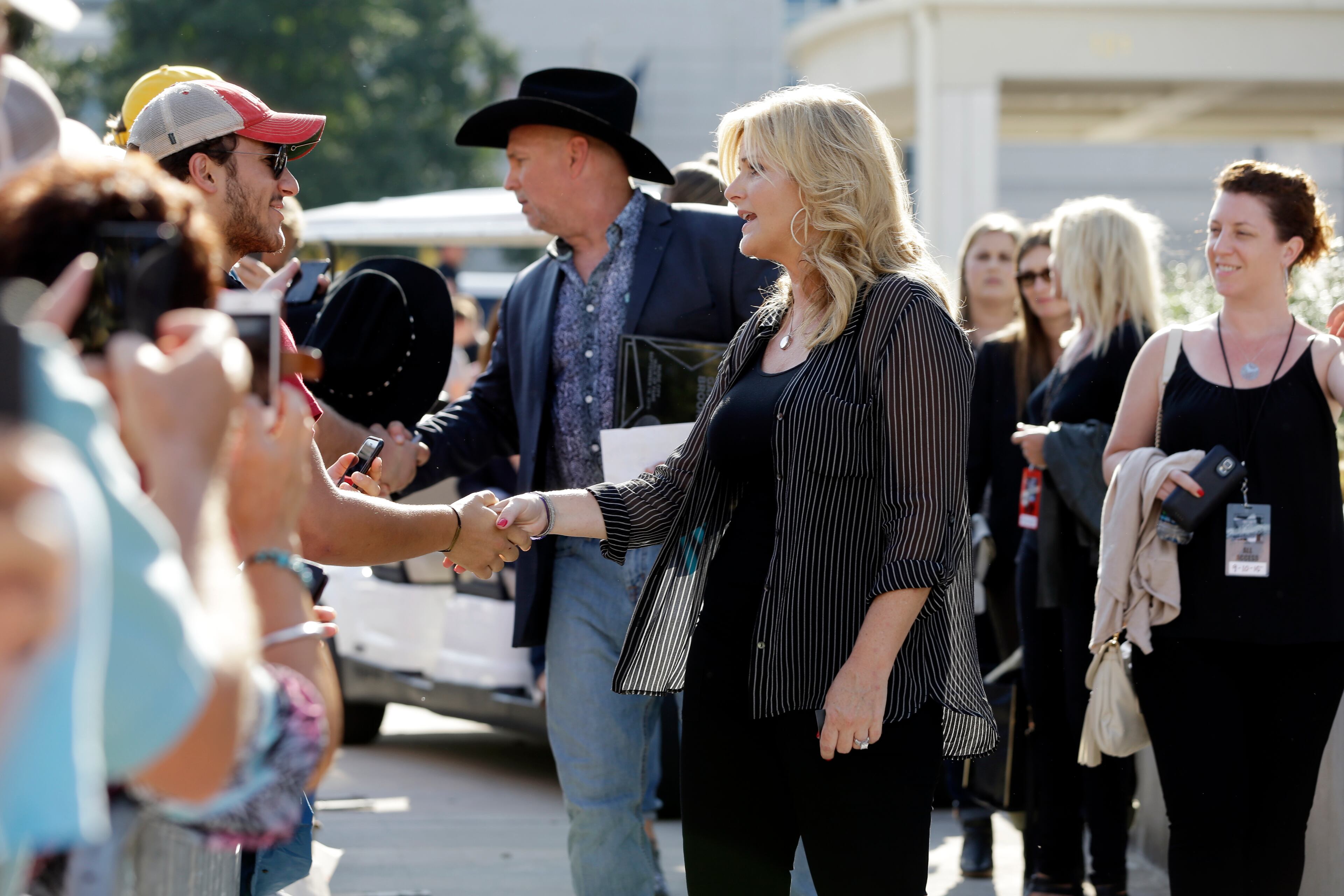 Garth Brooks and Trisha Yearwood greet fans after they both received a star on the Music City Walk of Fame on Thursday, Sept. 10, 2015, in Nashville, Tenn. (AP Photo/Mark Humphrey)