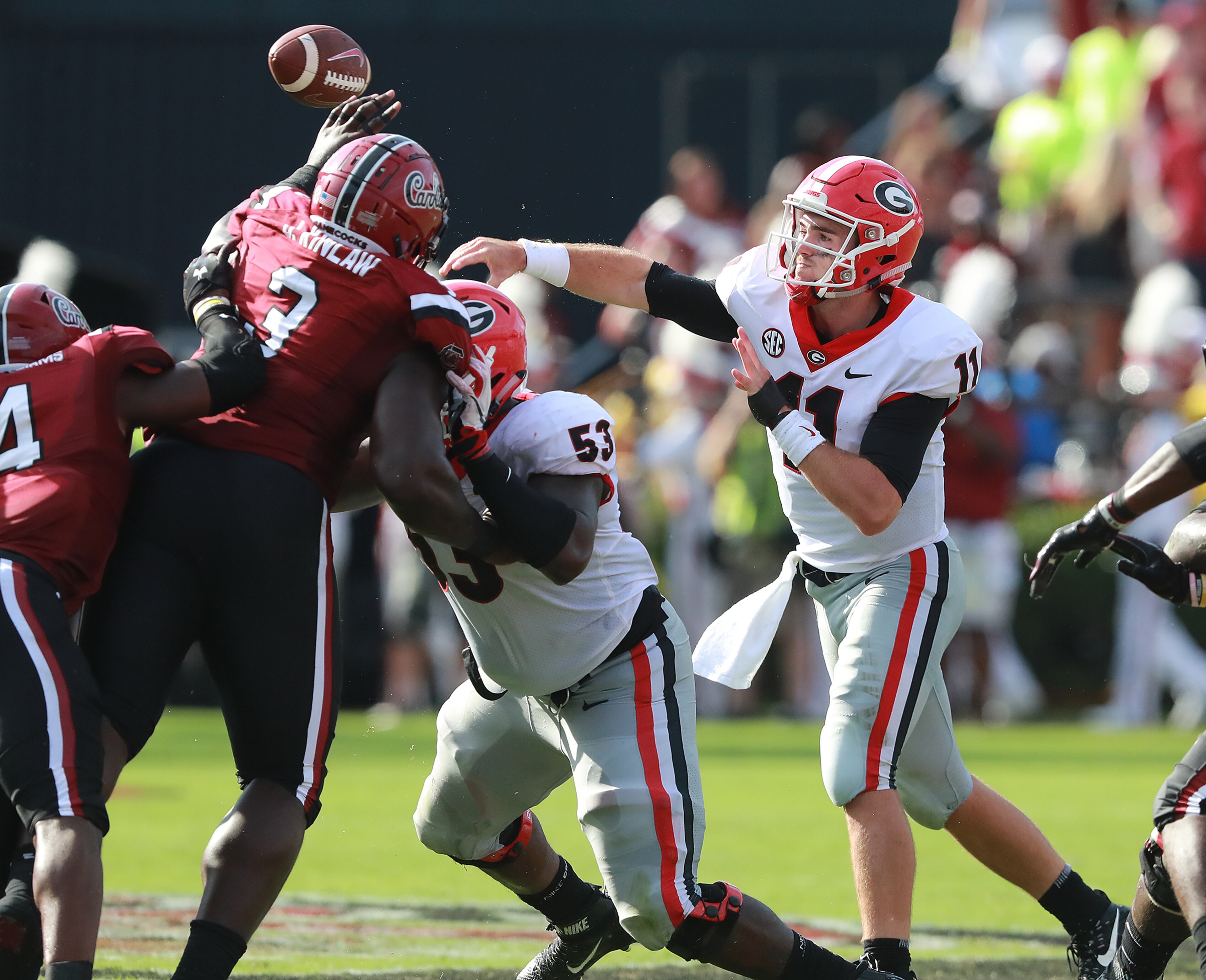 September 8, 2018 Columbia: Georgia quarterback Jake Fromm gets off a pass under pressure from South Carolina during the first half in a NCAA college football game on Saturday, Sept 8, 2018, in Columbia. Curtis Compton/ccompton@ajc.com