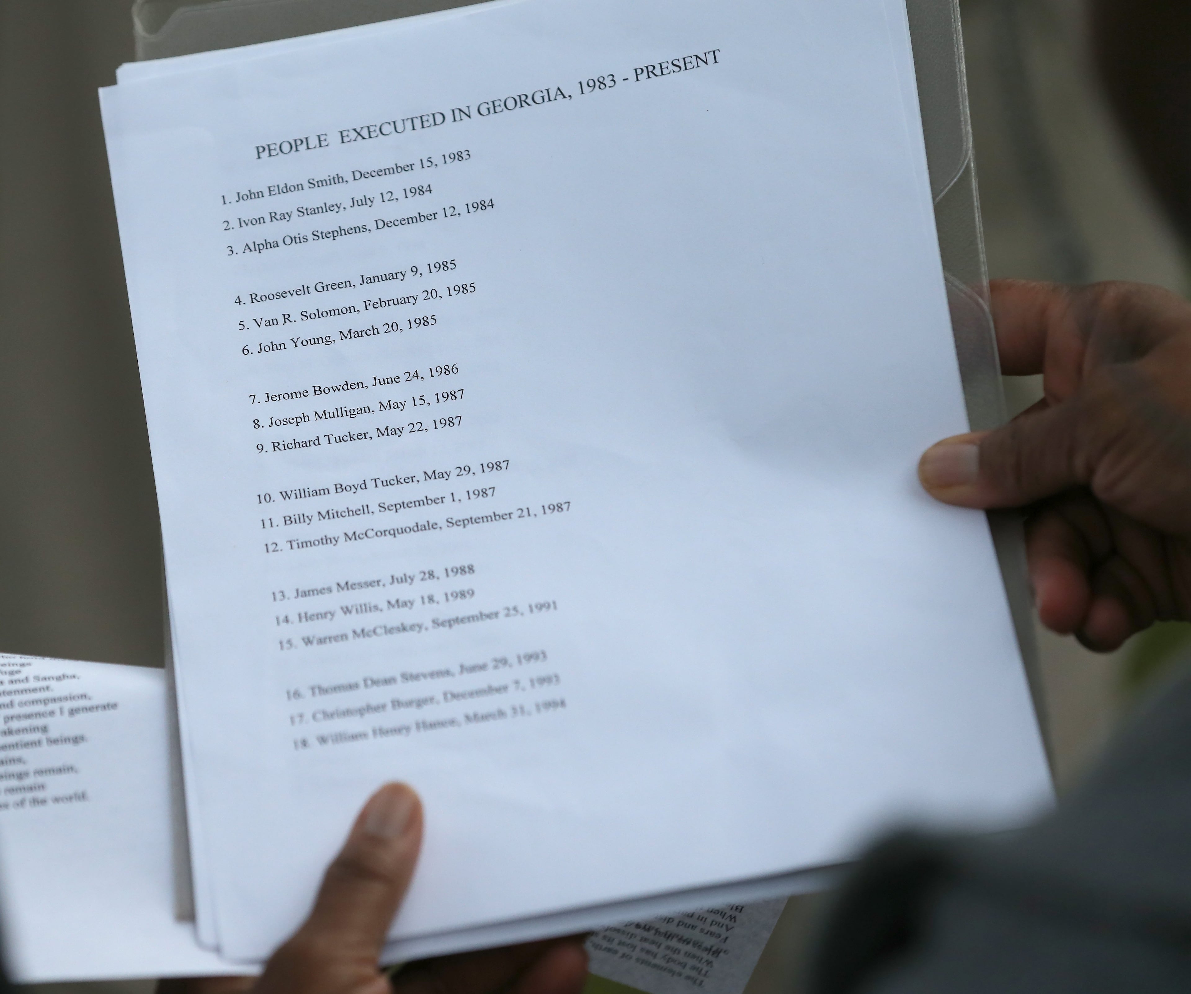 Death penalty opponents read aloud the names of those executed since 1983 during a vigil outside of the Georgia Diagnostic and Classification State Prison in Jackson on Wednesday evening April 27, 2016 at the time Daniel Anthony Lucas was scheduled to be executed for the 1998 murders of a Jones County father and his two children. Ben Gray / bgray@ajc.com