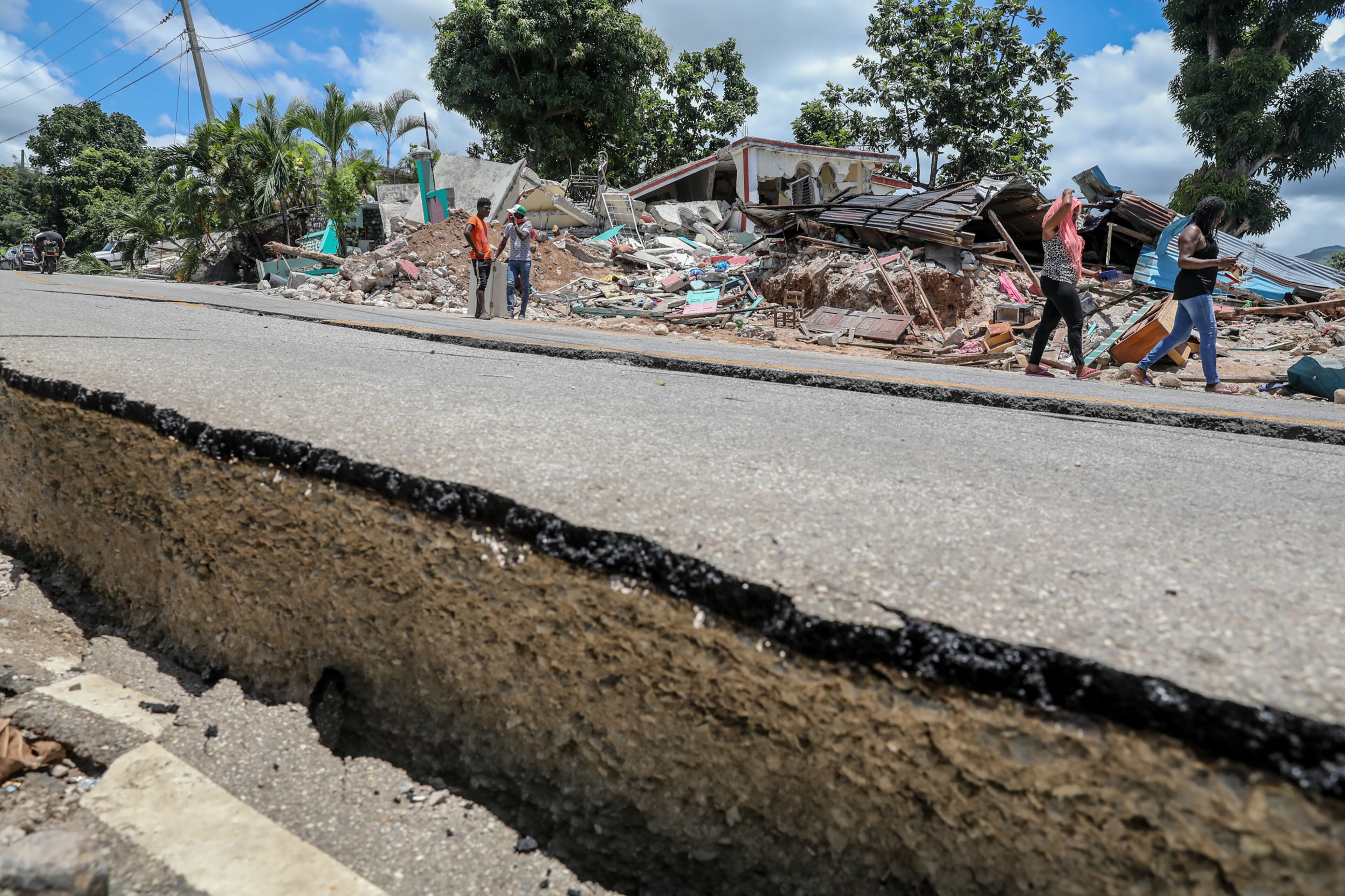 A road that cracked and shifted after an earthquake in the village of Marceline, Haiti, on Sunday, Aug, 15, 2021. Haitians struggled with a lack of basic supplies, including food and medical care, in the aftermath of a magnitude 7.2 earthquake on Saturday that snapped water lines, blocked roaCayes Airportds, flattened grocery stores and damaged hospitals on the country’s southwestern peninsula. (Valerie Baeriswyl/The New York Times)