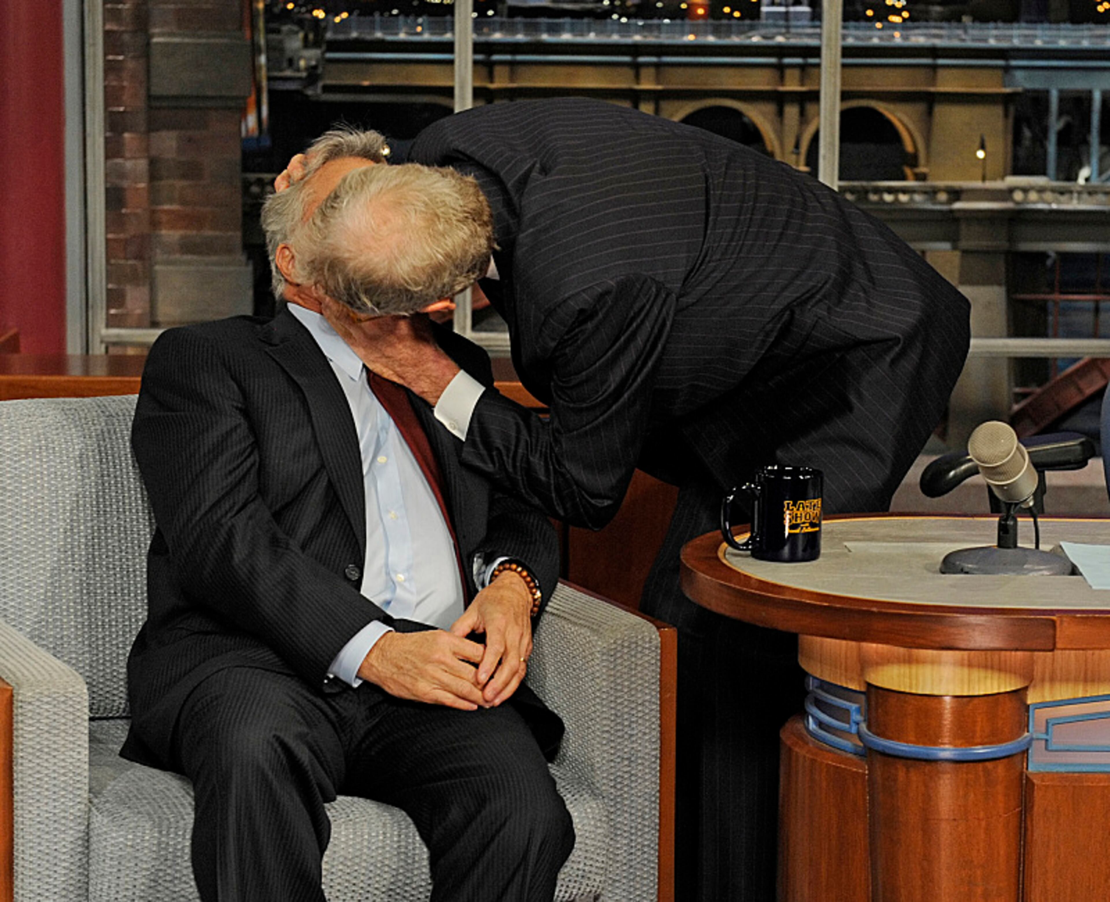 David Letterman plants a kiss on actor Dustin Hoffman when the fellow Kennedy Center Honoree visits the Late Show with David Letterman, to be broadcast Friday, Dec. 7 on the CBS Television Network. Photo: Jeffrey R. Staab/CBS 2012 CBS Broadcasting Inc. All Rights Reserved