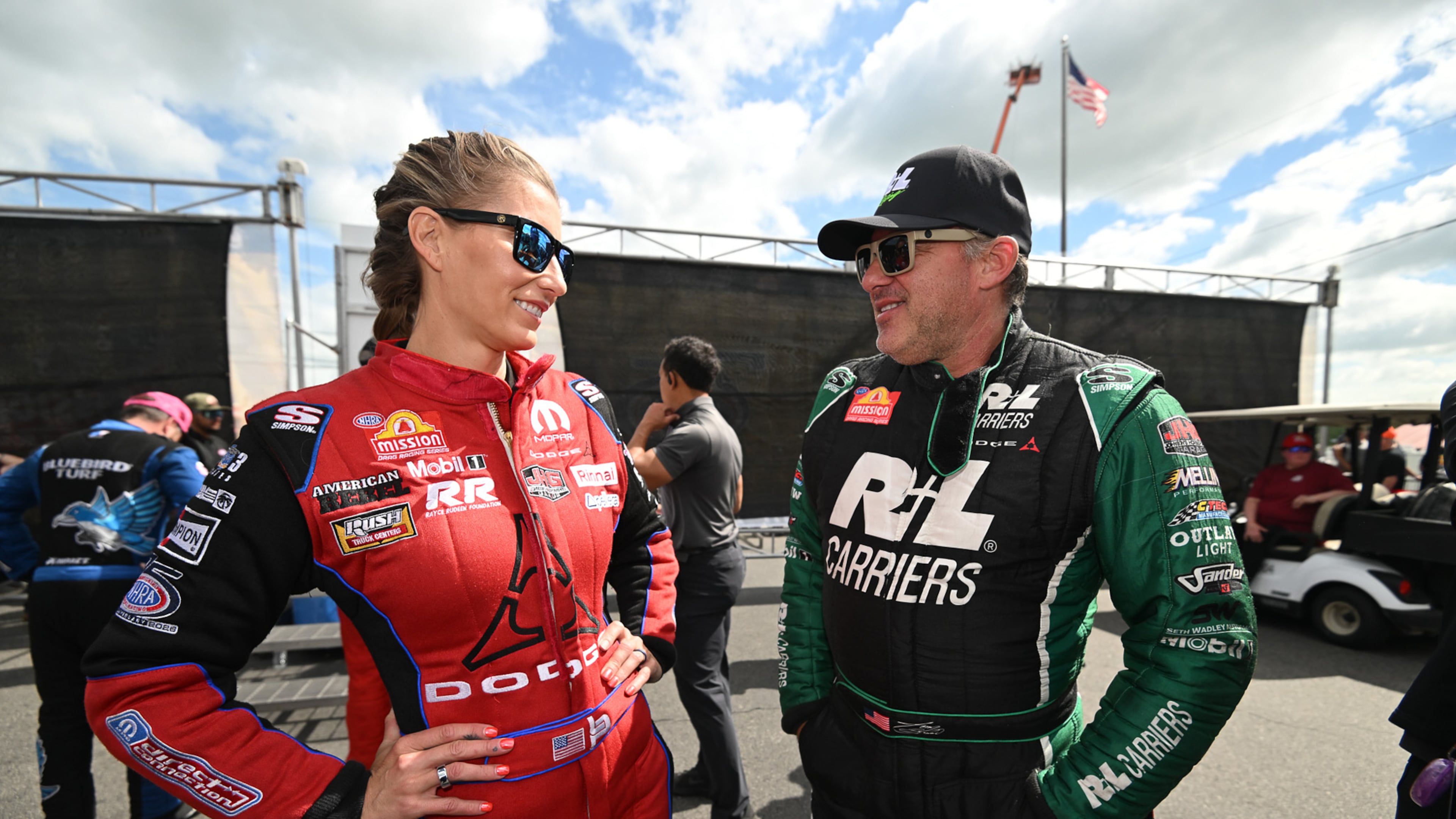 Married NHRA drivers Leah Pruett, left, and Tony Stewart chat pre-race at New England Dragway in Epping, NH, Sunday, June 7, 2026, for the NHRA New England Nationals. (Marc Gewertz/NHRA via AP)