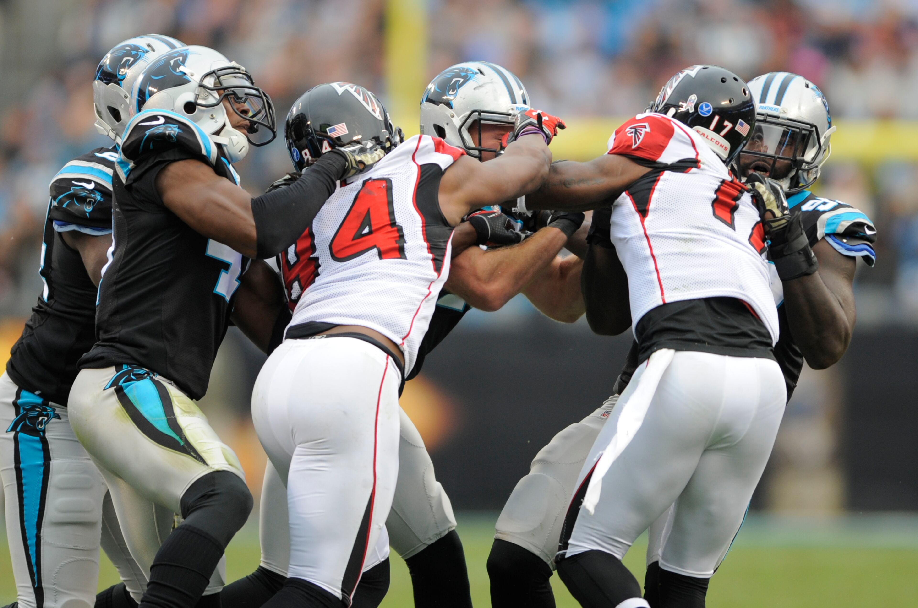 Carolina Panthers players scuffle with Atlanta Falcons players in the second half of an NFL football game in Charlotte, N.C., Sunday, Nov. 16, 2014. (AP Photo/Mike McCarn)