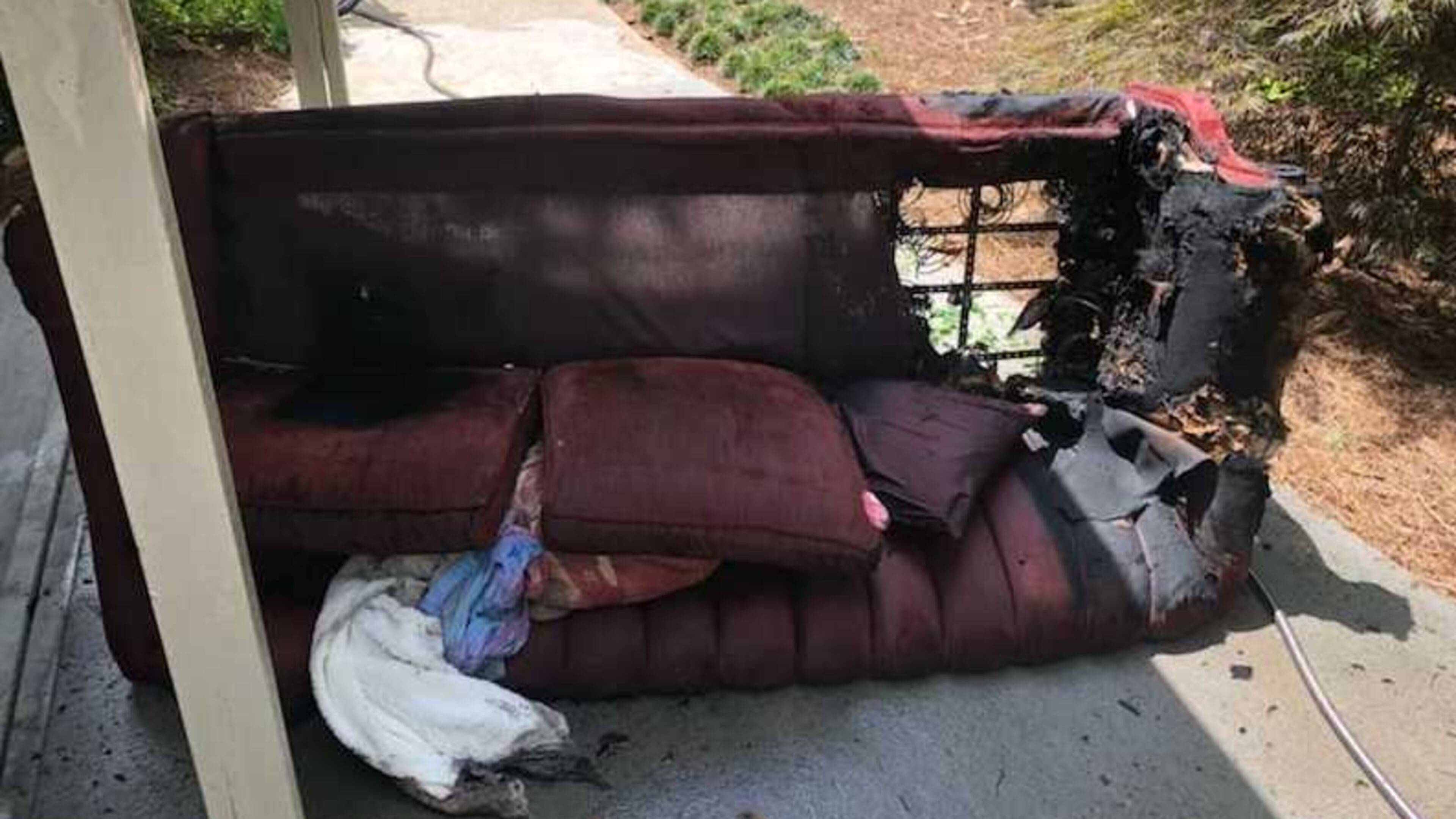 A woman might have been smoking on her couch when a fire overwhelmed her, but a neighbor smashed her sliding glass door wish a rock and dragged her from the flames on Friday, July 20, 2018, said Cobb County fire authorities.