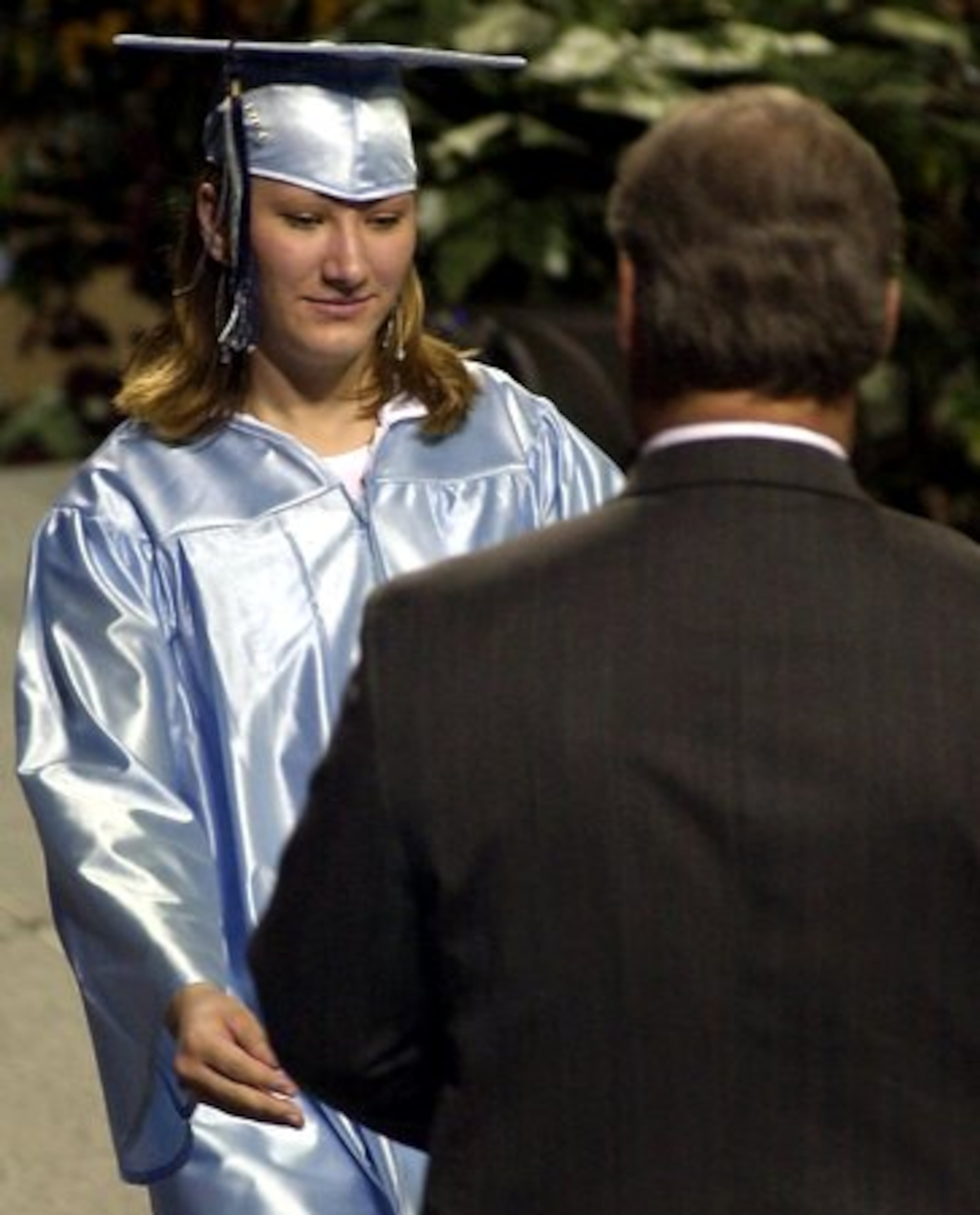 Jessica McClure, known to the world as "Baby Jessica," receives her high school diploma on May 28, 2004 at Greenwood High School near Midland, Texas. The young wife and mother is living quietly in this West Texas oil patch city, the same one where she fell into the backyard well.