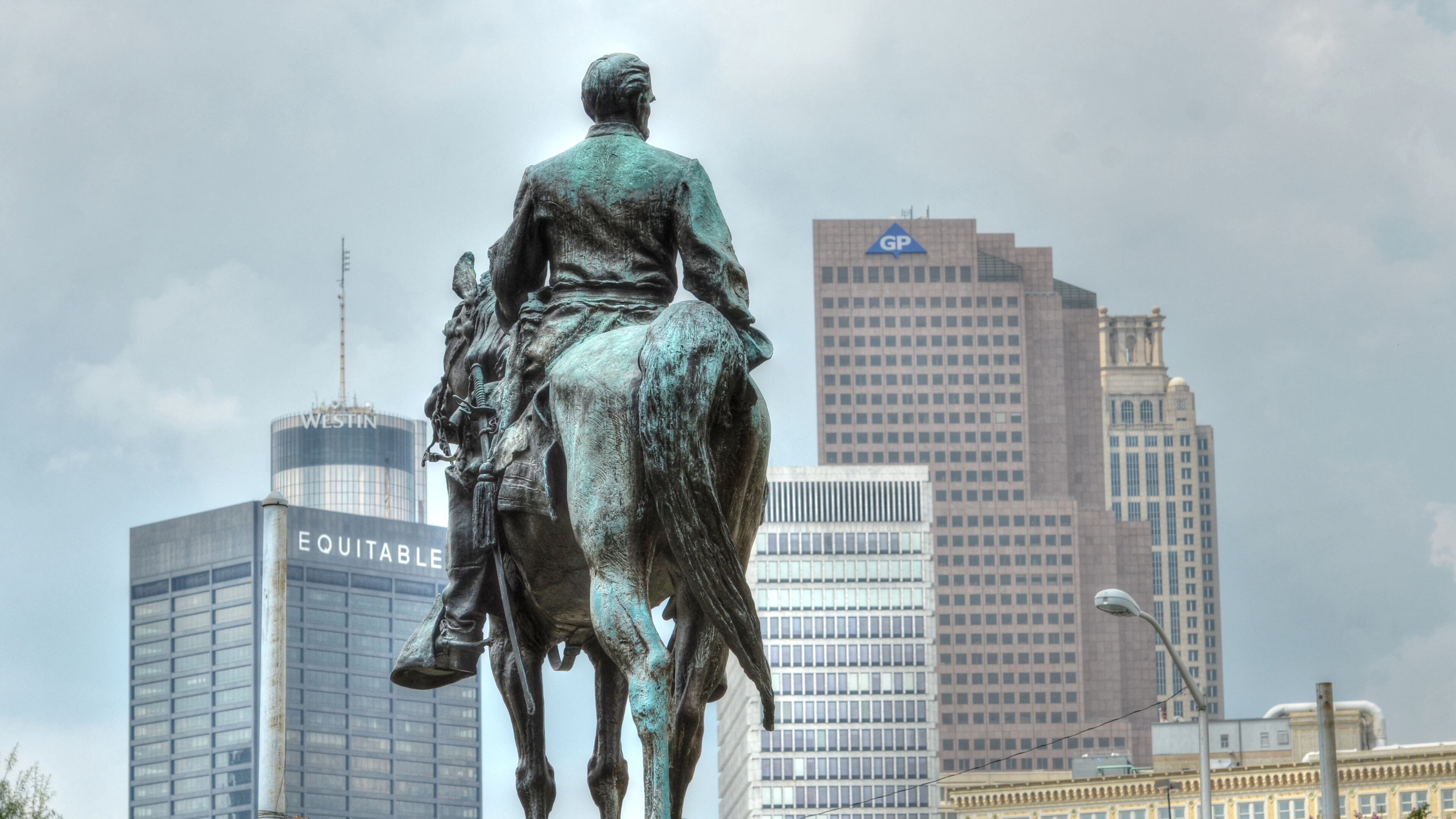 The statue of John Brown Gordon, U.S. senator, governor and Confederate general at the State Capitol, against the backdrop of downtown Atlanta. AJC/Chris Hunt