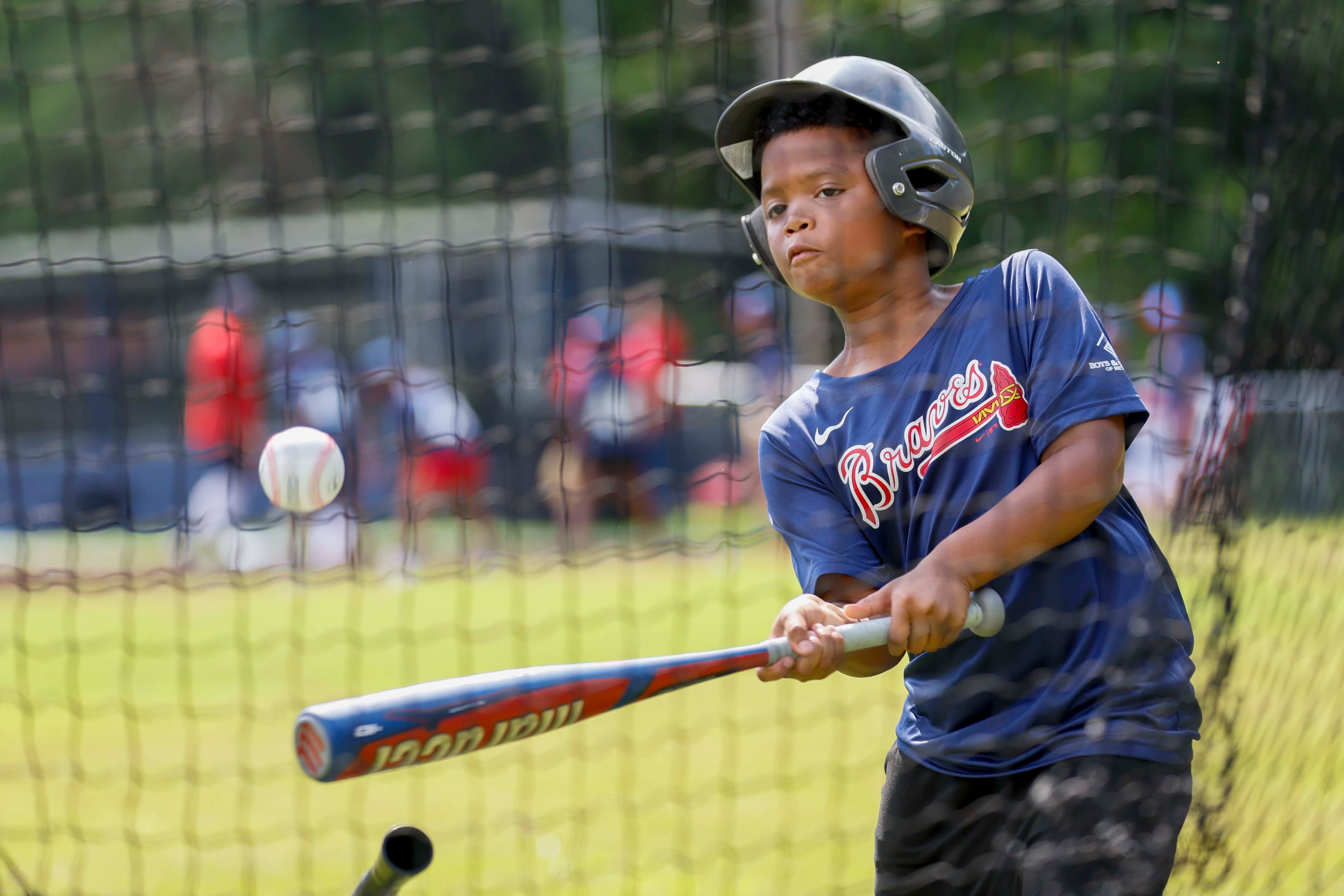 A kid is seen participating in a drill during the unveiling of the new All-Star Legacy Field at the Barksdale Boys & Girls Club in Conyers on Thursday, July 10, 2025. The event takes place during the MLB All-Star Game week in Atlanta.
(Miguel Martinez/ AJC)