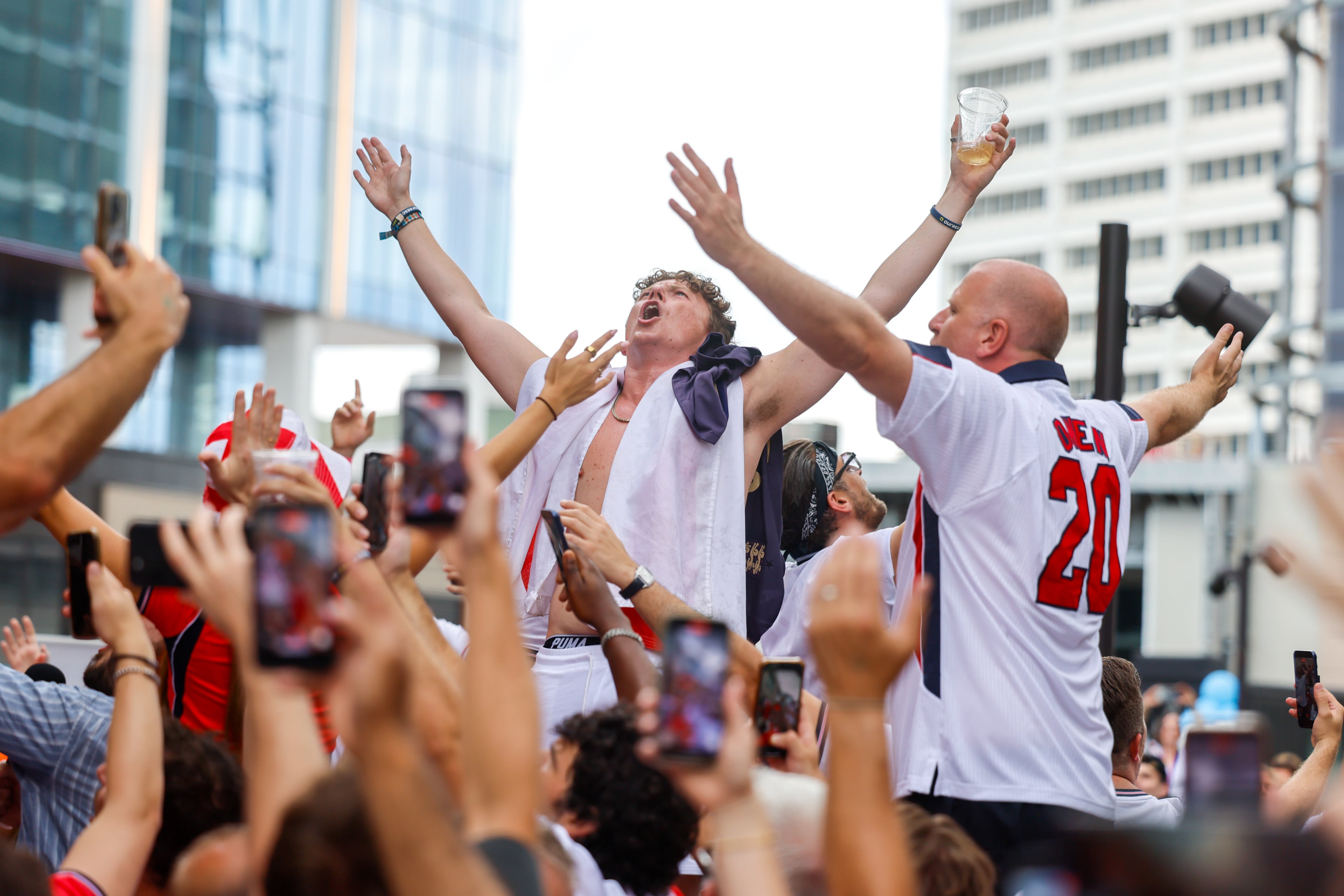 England fans celebrate at Irish Exit before the FIFA World Cup game against Argentina in Atlanta on July 15, 2026. It’s the final World Cup match Atlanta is hosting. (Arvin Temkar/AJC)