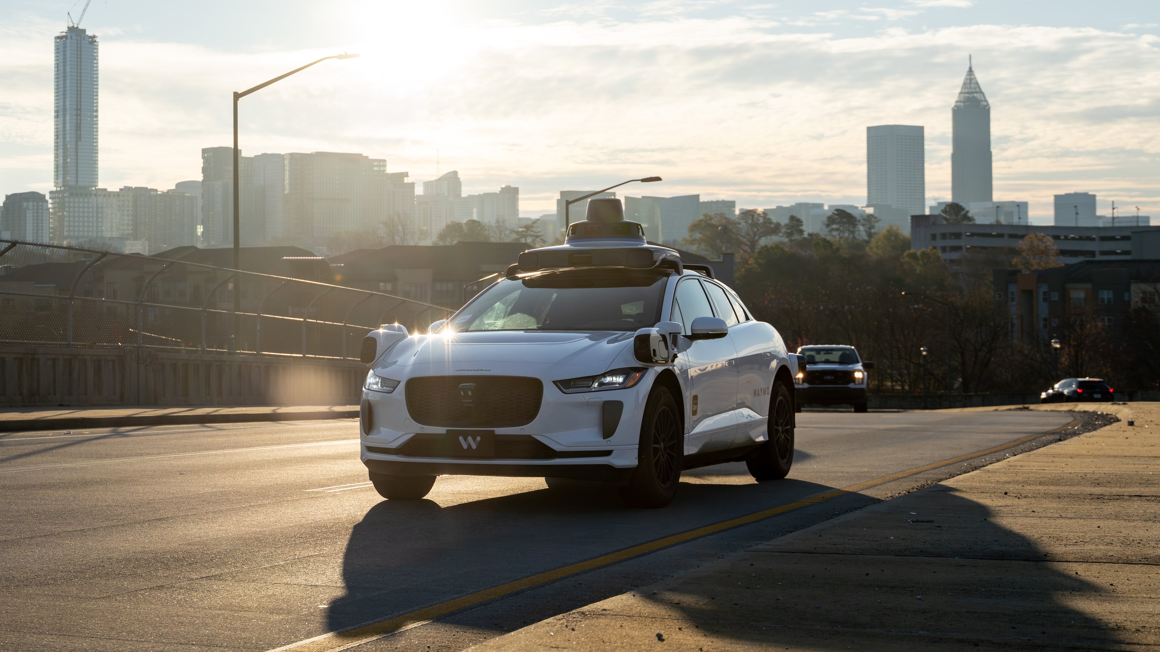 A Waymo self-driving taxi travels down 17th Street in Atlanta on Thursday, Dec. 11, 2025. (Ben Hendren for the AJC)