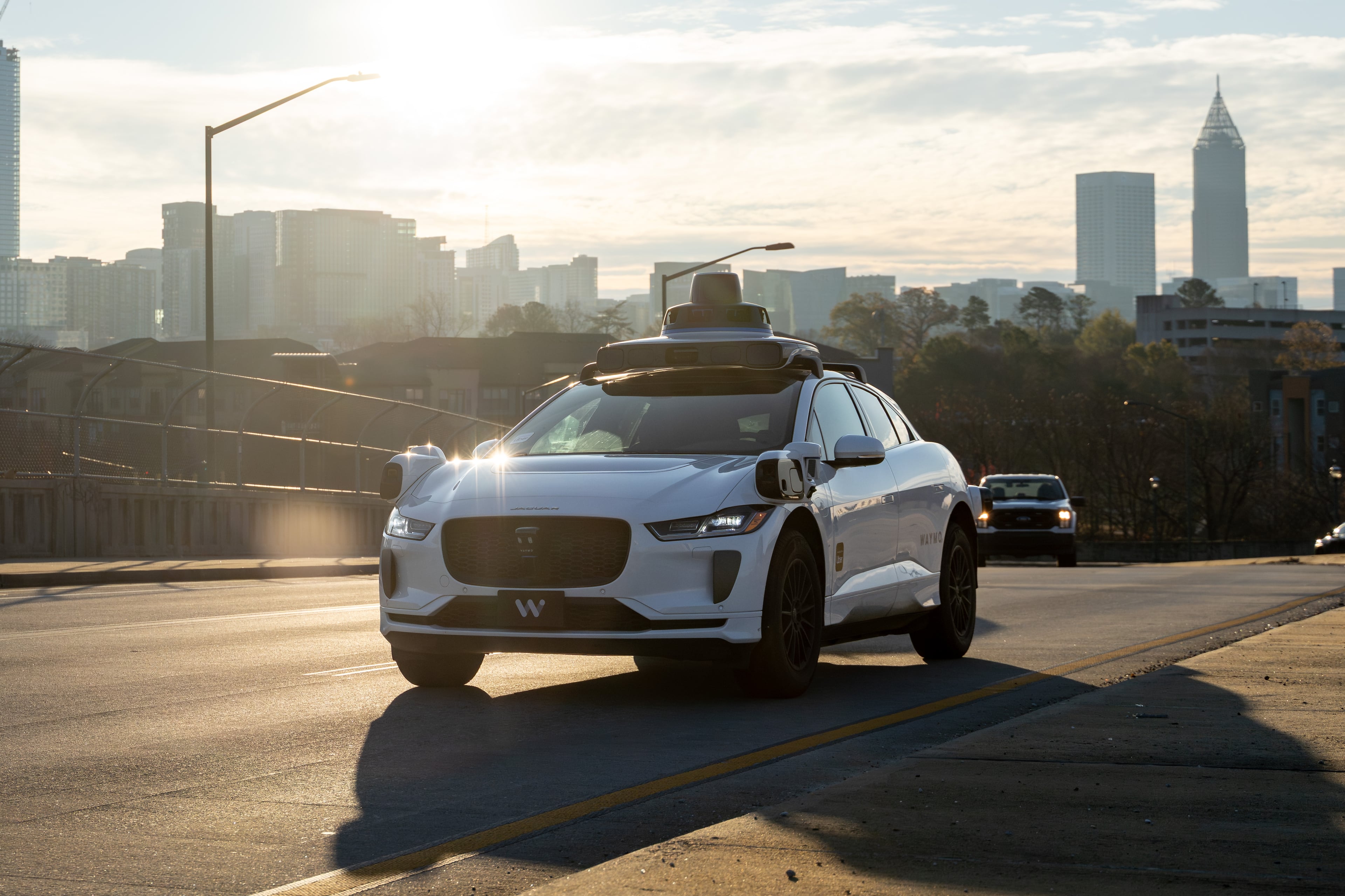 A Waymo self-driving taxi travels down 17th Street in Atlanta on Thursday, Dec. 11, 2025. (Ben Hendren for the AJC)