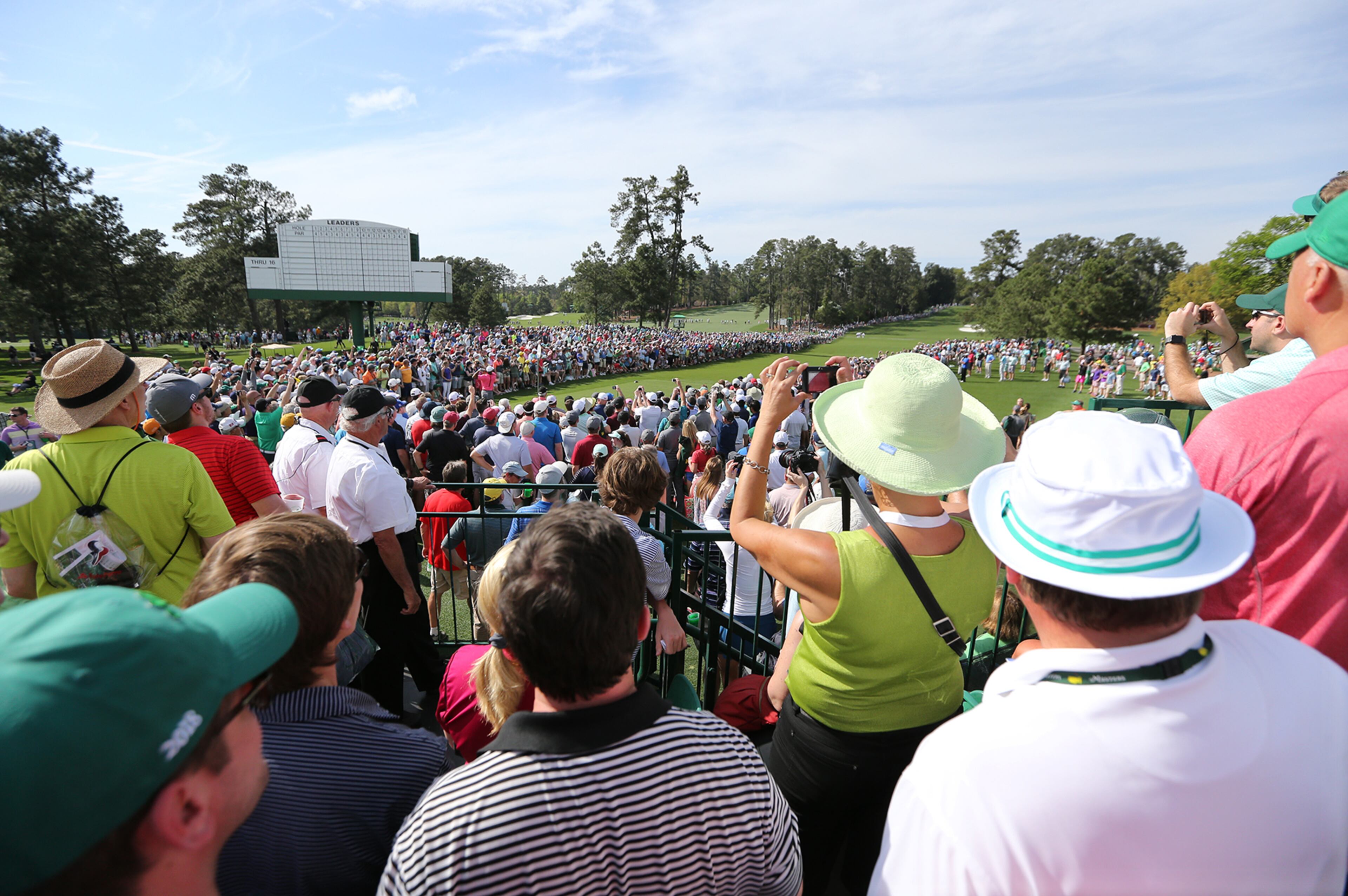 April 2, 2018 Atlanta: A massive gallery around the tee box at the 8th hole trys to get a look at Tiger Woods while he tees off during his practice round for the Masters at Augusta National Golf Club on Monday, April 2, 2018, in Augusta. Curtis Compton/ccompton@ajc.com