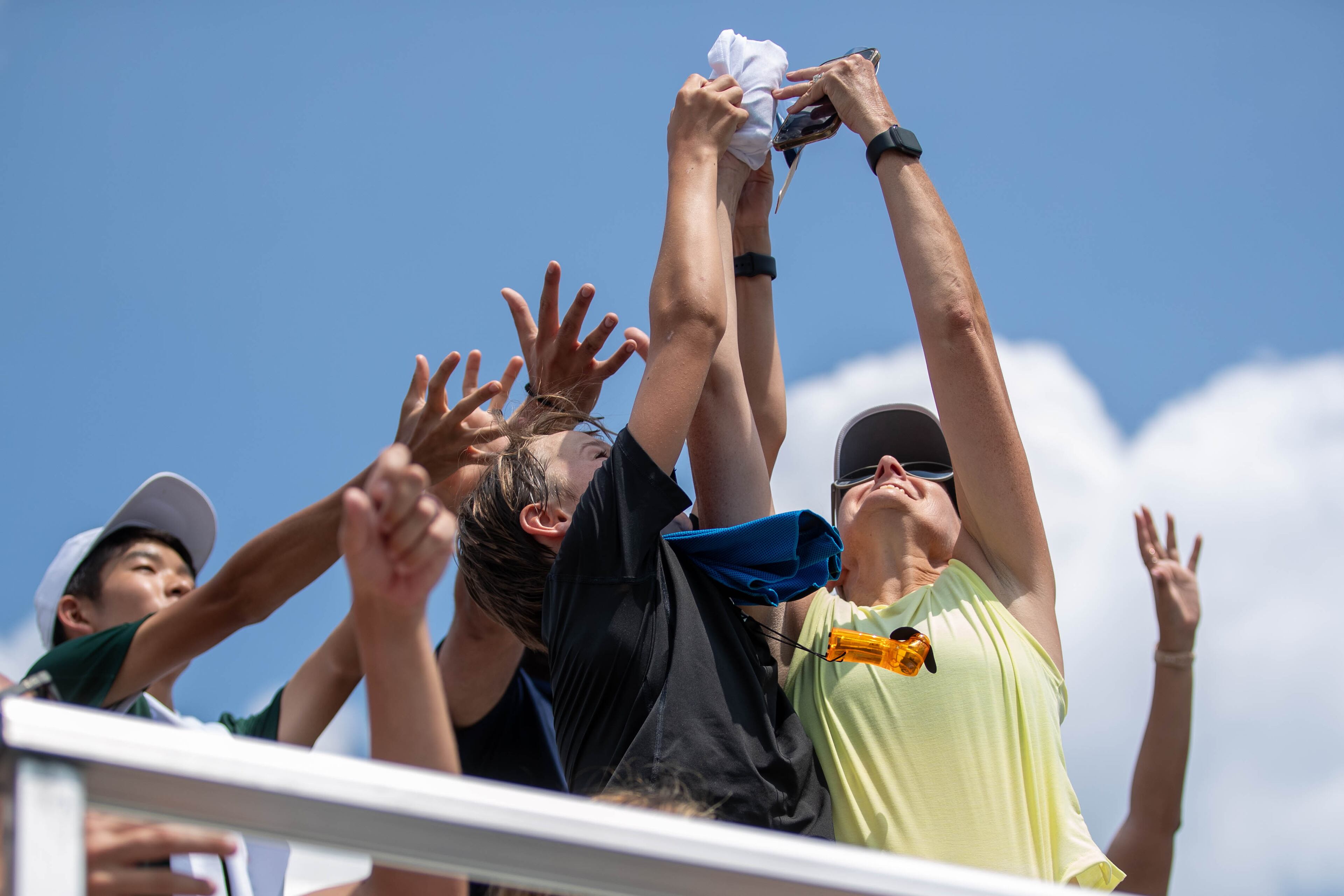Fans jump to grab a free t-shirt at the Atlanta Open. (Katelyn Myrick/katelyn.myrick@ajc.com)