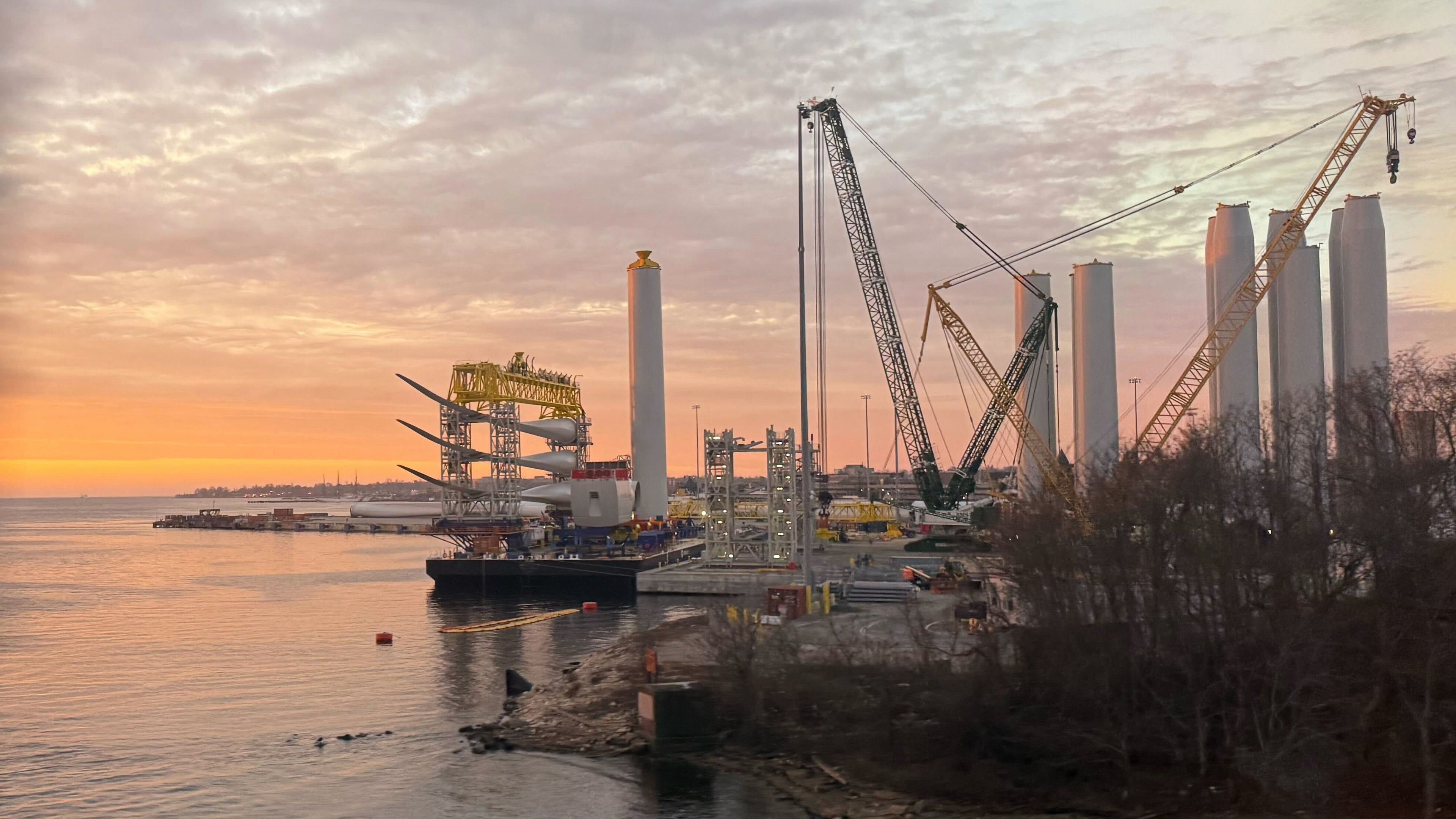 Blades and turbine bases for offshore wind sit at a staging area at New London State Pier, Wednesday, Jan. 14, 2026, in New London, Conn. (AP Photo/Matt O'Brien)