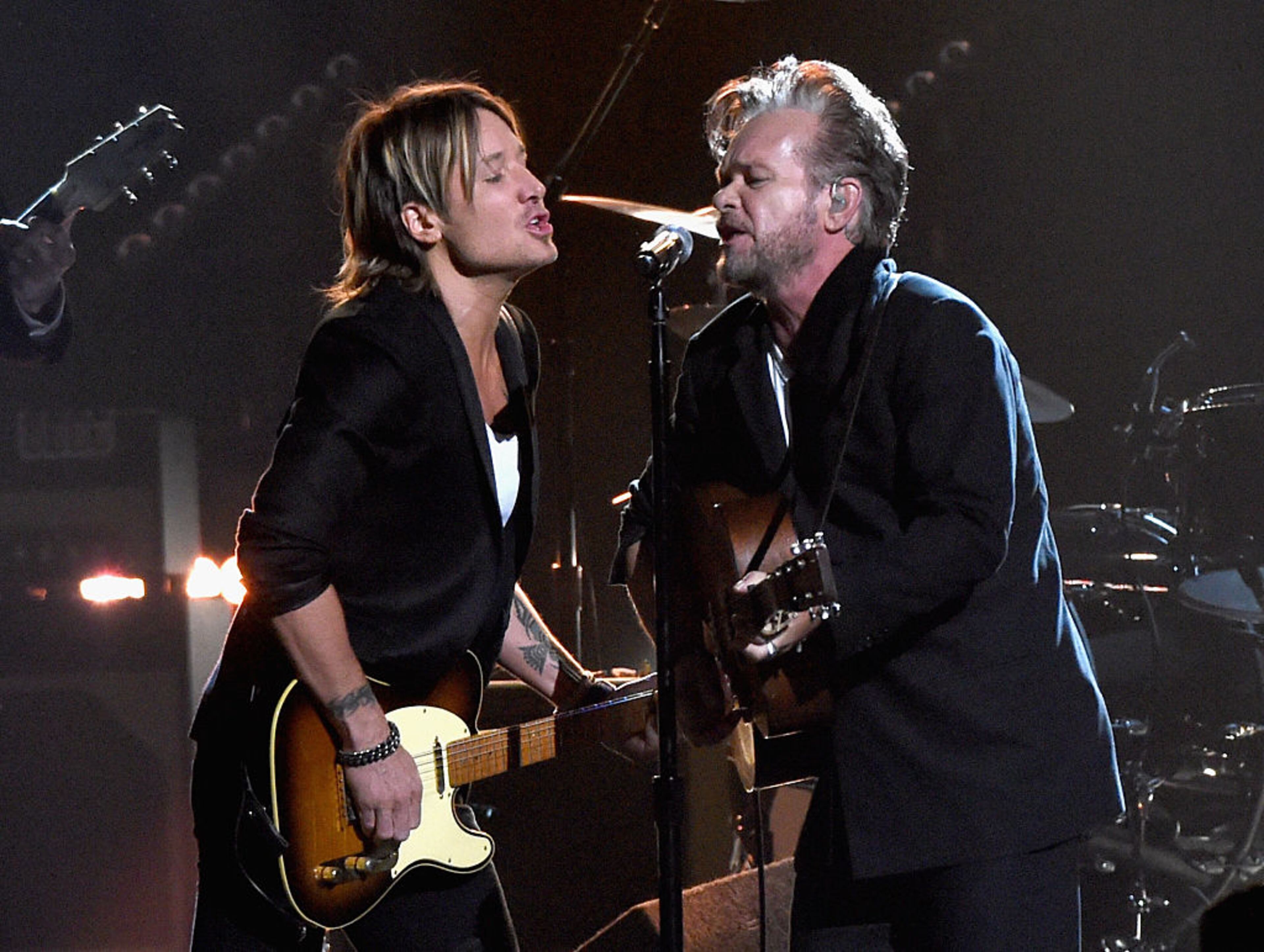 NASHVILLE, TN - NOVEMBER 04: Musicians Keith Urban (L) and John Mellencamp perform onstage at the 49th annual CMA Awards at the Bridgestone Arena on November 4, 2015 in Nashville, Tennessee. (Photo by Rick Diamond/Getty Images)