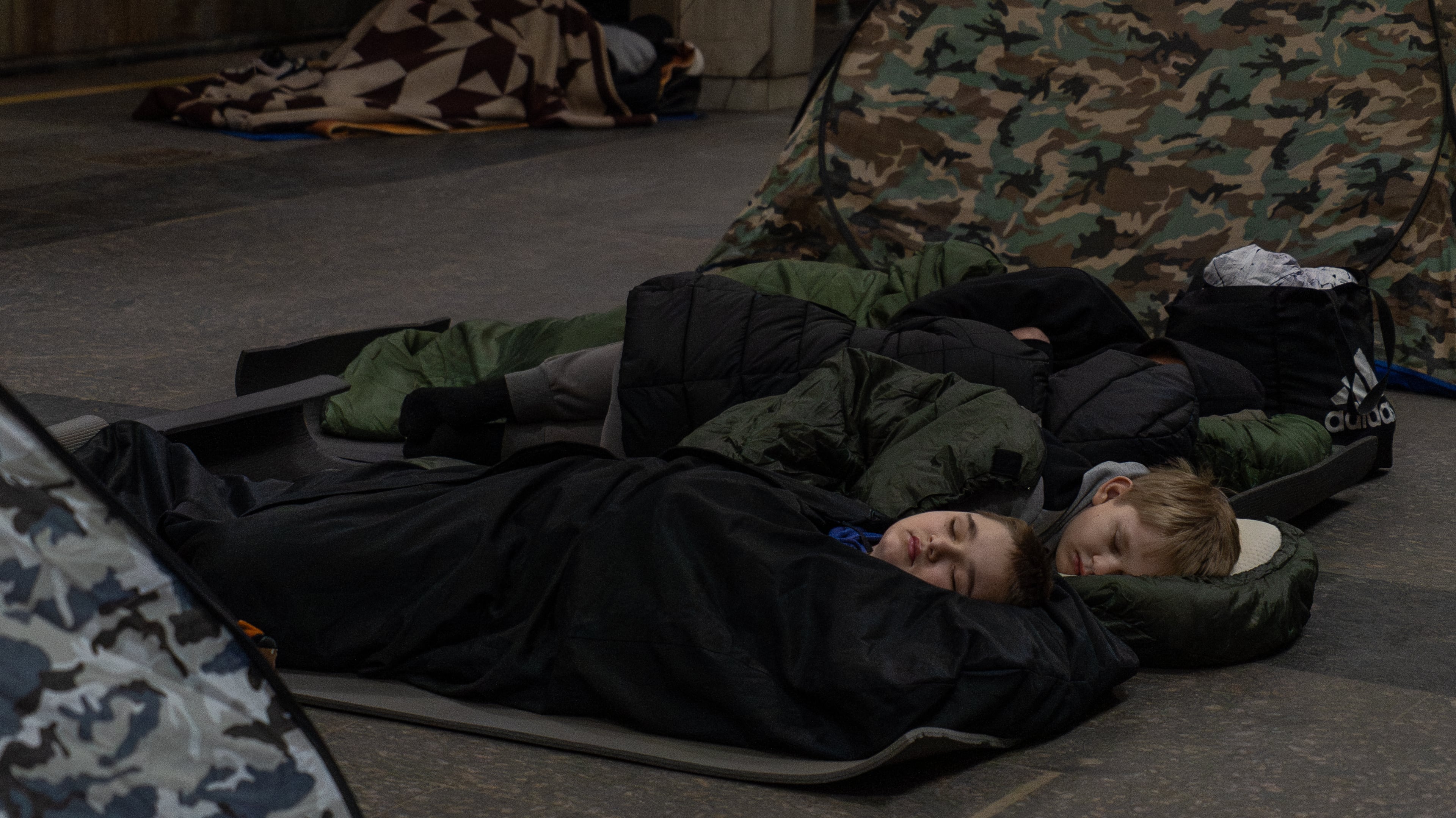 People take shelter in a metro station, being used as a bomb shelter, during a Russian drones attack in Kyiv, Ukraine, Tuesday, Feb. 3, 2026. (AP Photo/Alex Babenko)