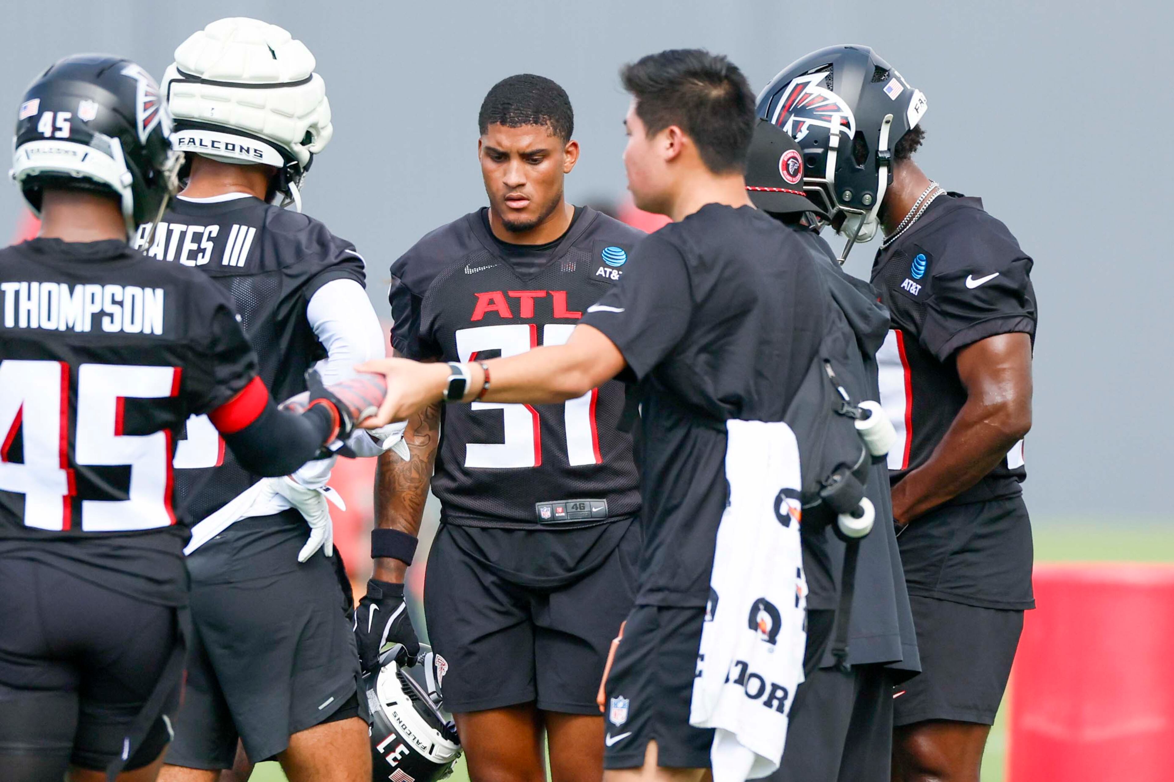 Atlanta Falcons safety Xavier Watts, center, is seen with teammates during the first practice of training camp on Thursday, July 24, 2025, in Flowery Branch. (Miguel Martinez/AJC)