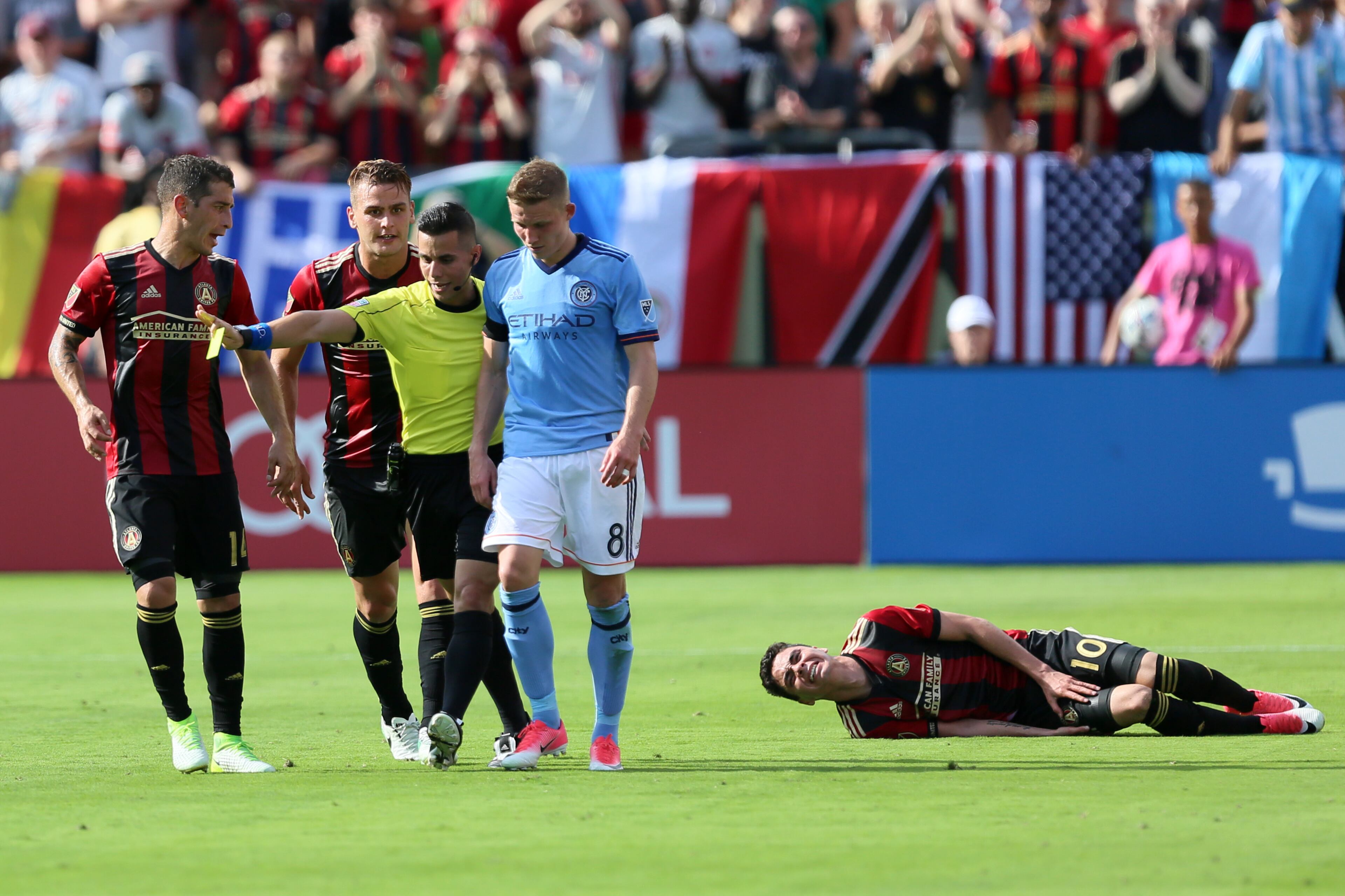 New York City's Alexander Ring show frustation and got a yellow card for the foul against Miguel Almiron. Miguel Martinez/Mundo Hispanico