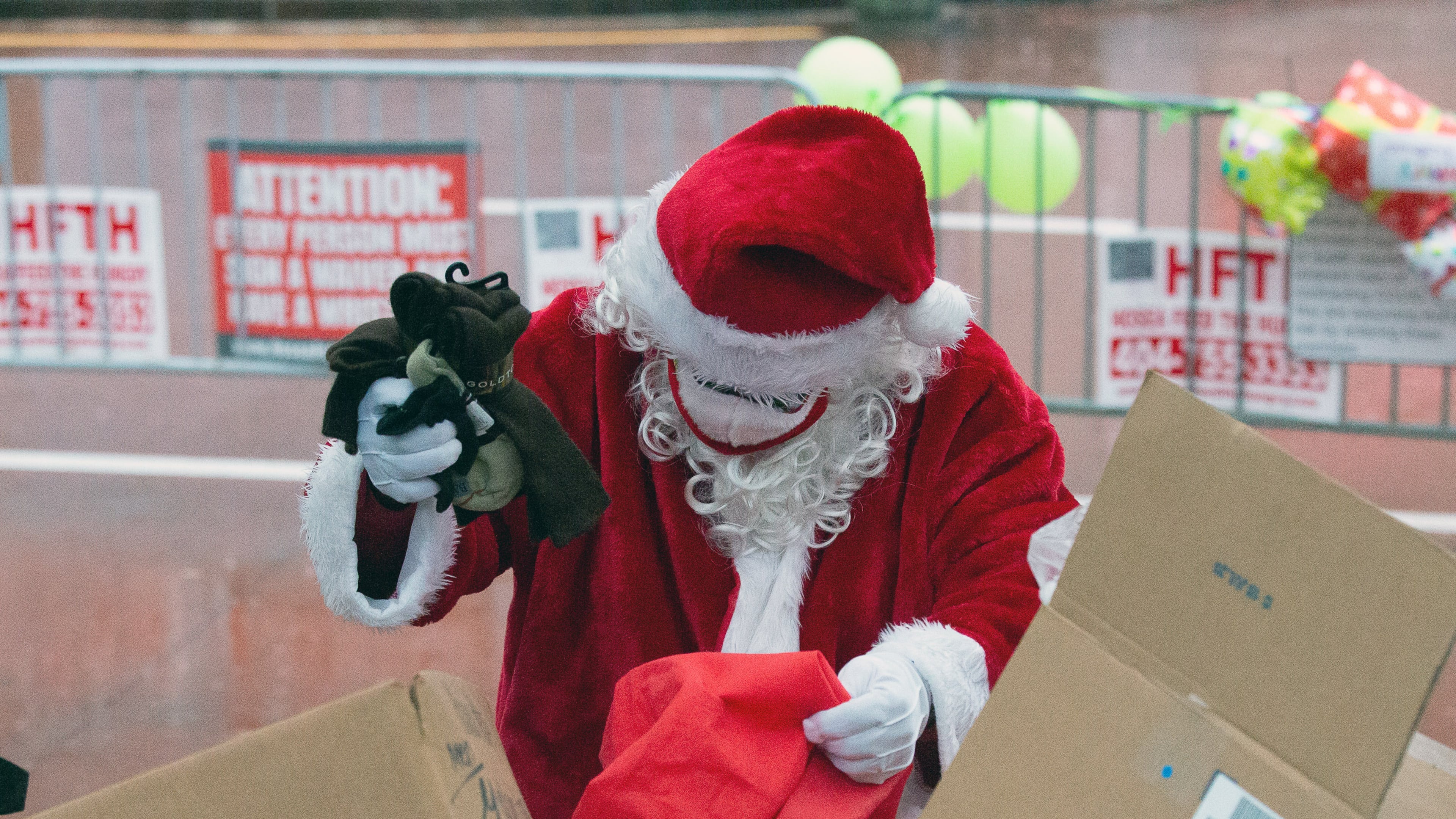 Santa loads his bag of goodies before the start of the Hosea Helps Annual Christmas Event at the Georgia World Congress Center on Thursday, December 24, 2020. STEVE SCHAEFER FOR THE ATLANTA JOURNAL-CONSTITUTION
