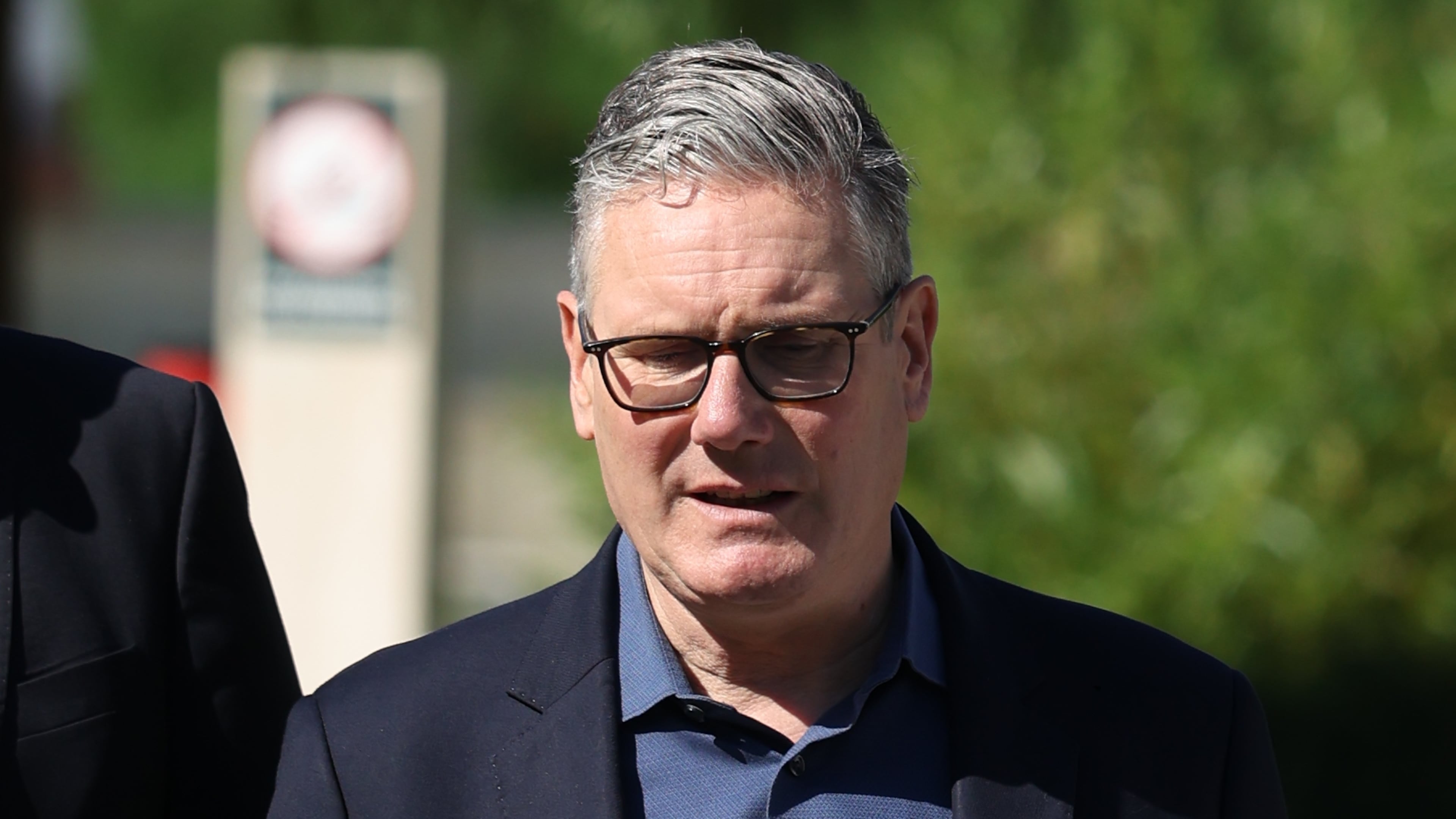 Britain's Prime Minister Keir Starmer walks, as he visits a housing development in north London, Friday, June 19, 2026. (Peter Macdiarmid/Pool Photo via AP)