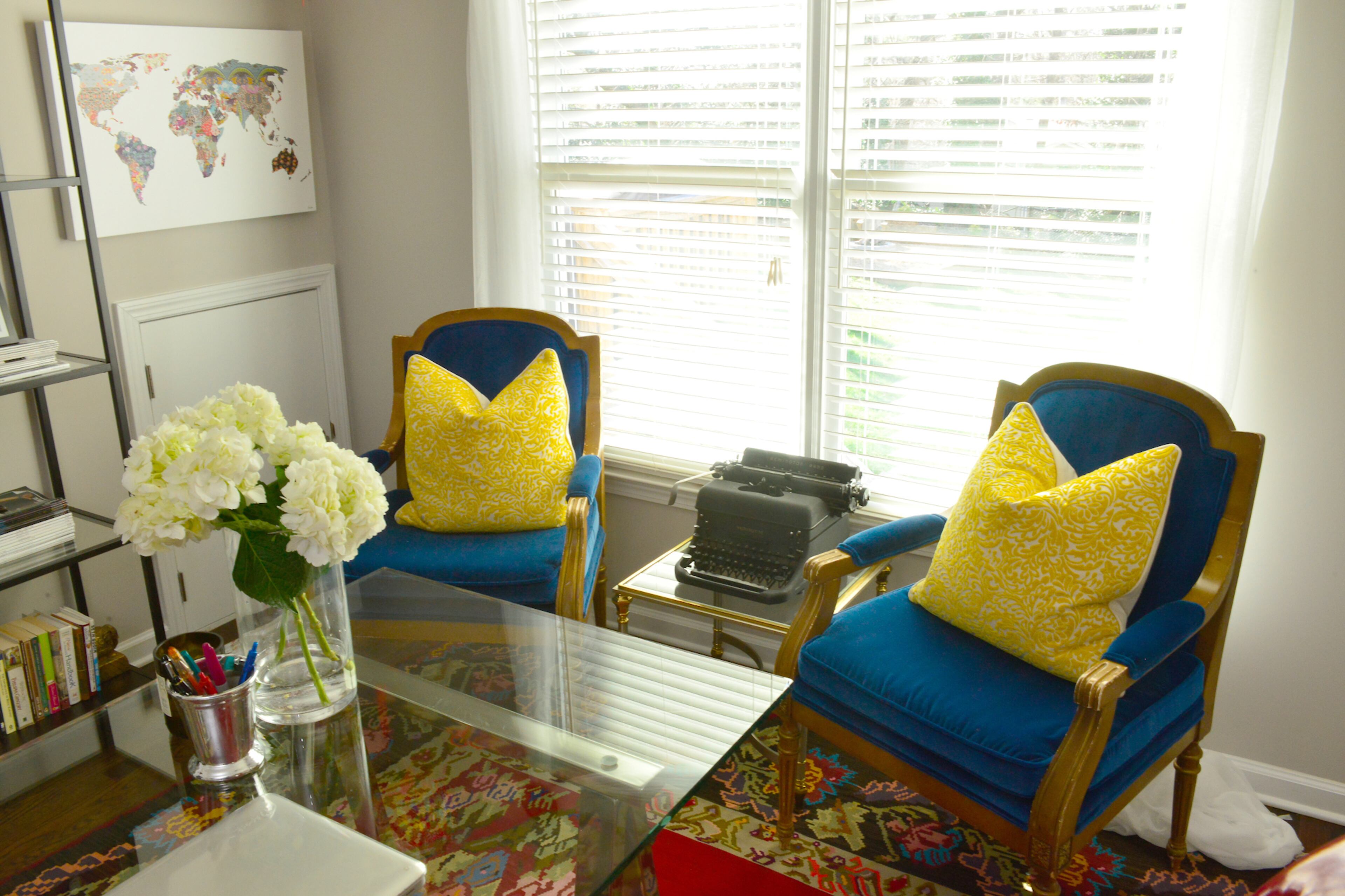 Homeowner Jennifer Franklin found antique French chairs at Antiques and Beyond on Cheshire Bridge Road and recovered them in blue velvet from Lewis & Sheron Textiles for her home office. Art on the walls and shelves reflect her travels, while the vintage typewriter is a nod to her career as a writer. Text by Lori Johnston and Keith Still/Fast Copy News Service.
