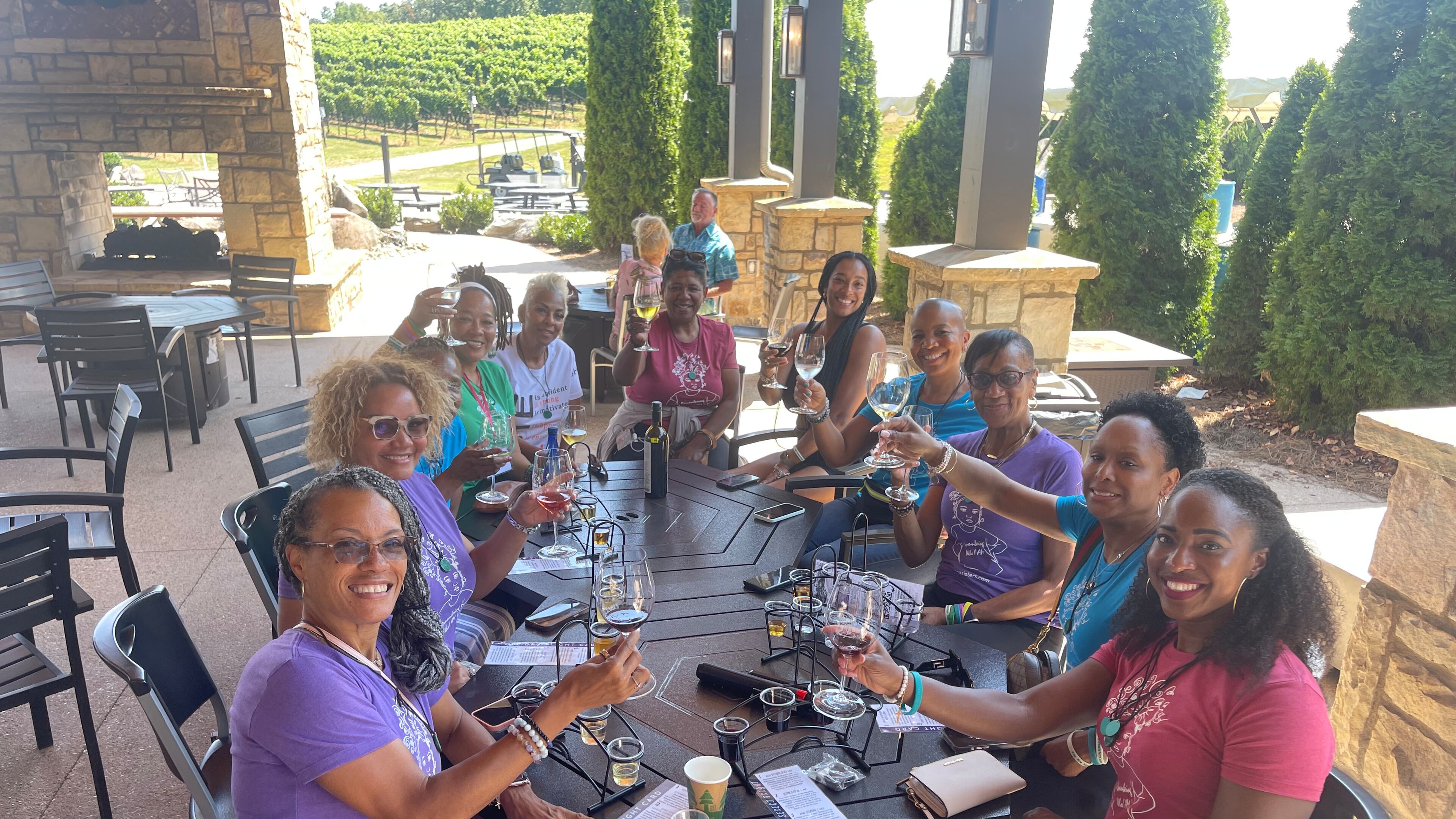 Imani Monica McCullough (fourth from right) founded YANASISTERS in 2013 as a community designed to support women experiencing loneliness and isolation by providing intergenerational wisdom, connection, and personal growth. Image credit: Briene M. Simmons