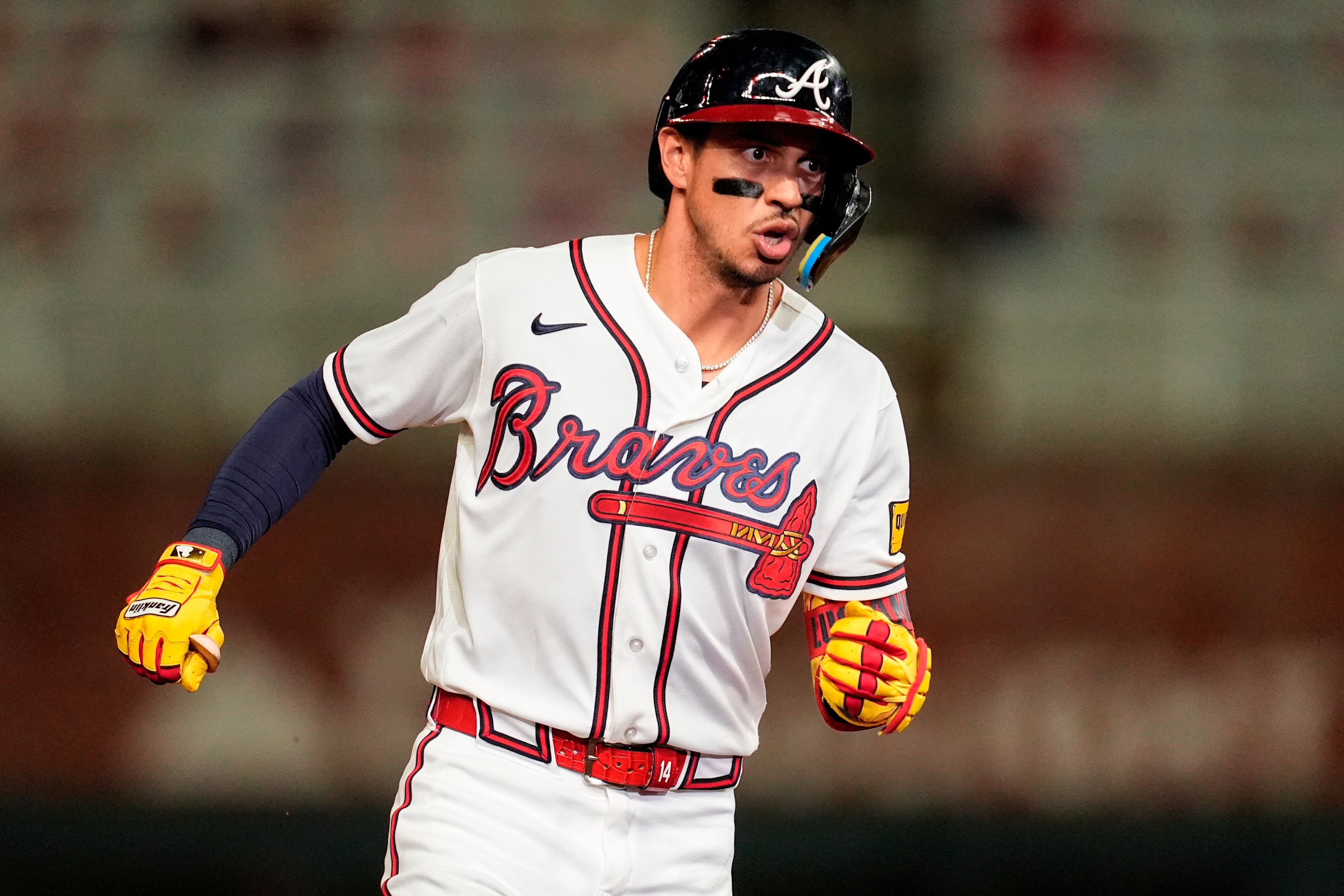 Mauricio Dubón celebrates his two-run homer against the Cubs on Wednesday. (Mike Stewart/AP)