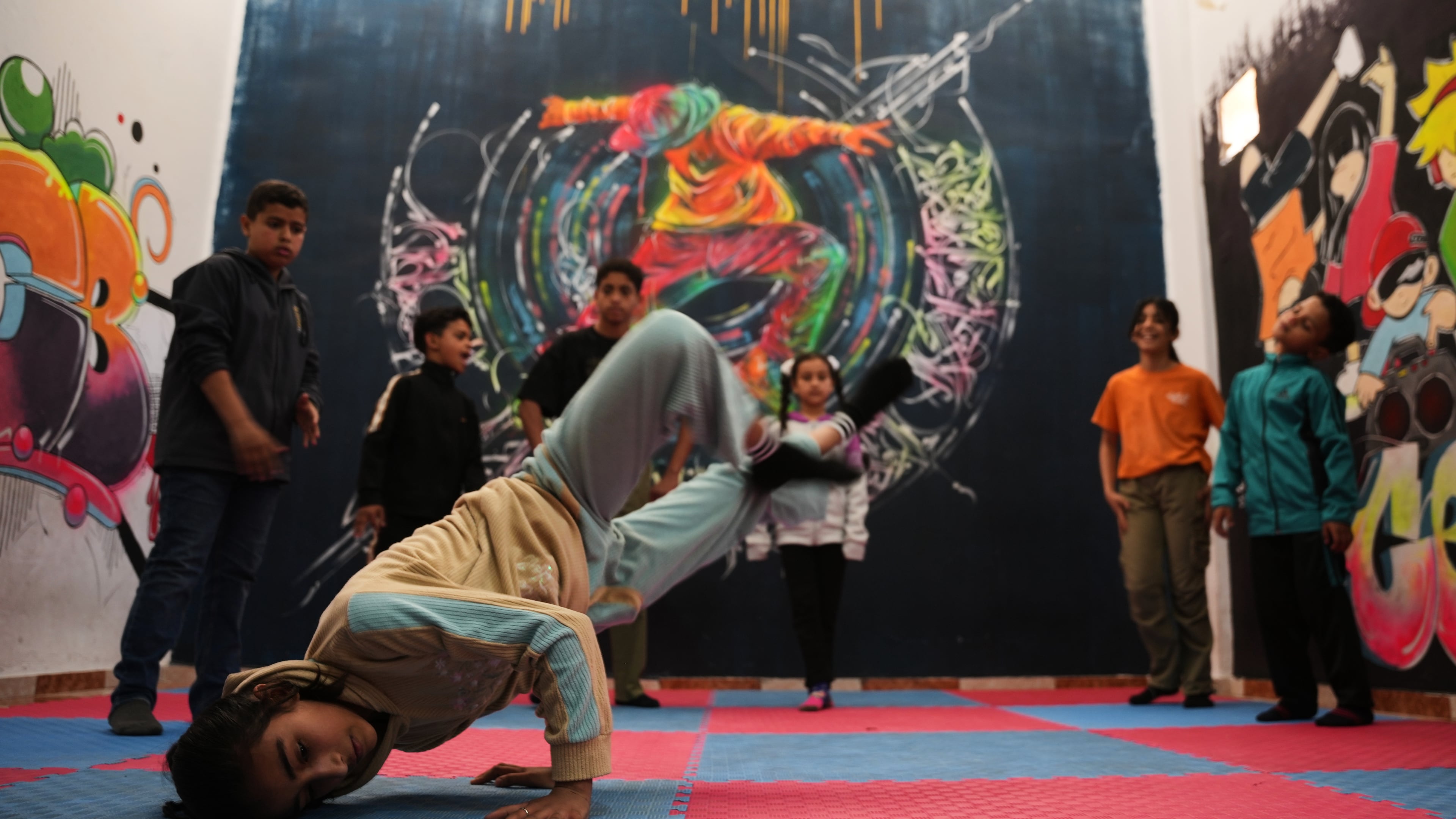 Palestinian children practice breakdancing in a dance studio in Nuseirat, central Gaza Strip, Monday, May 4, 2026. (AP Photo/Abdel Kareem Hana)