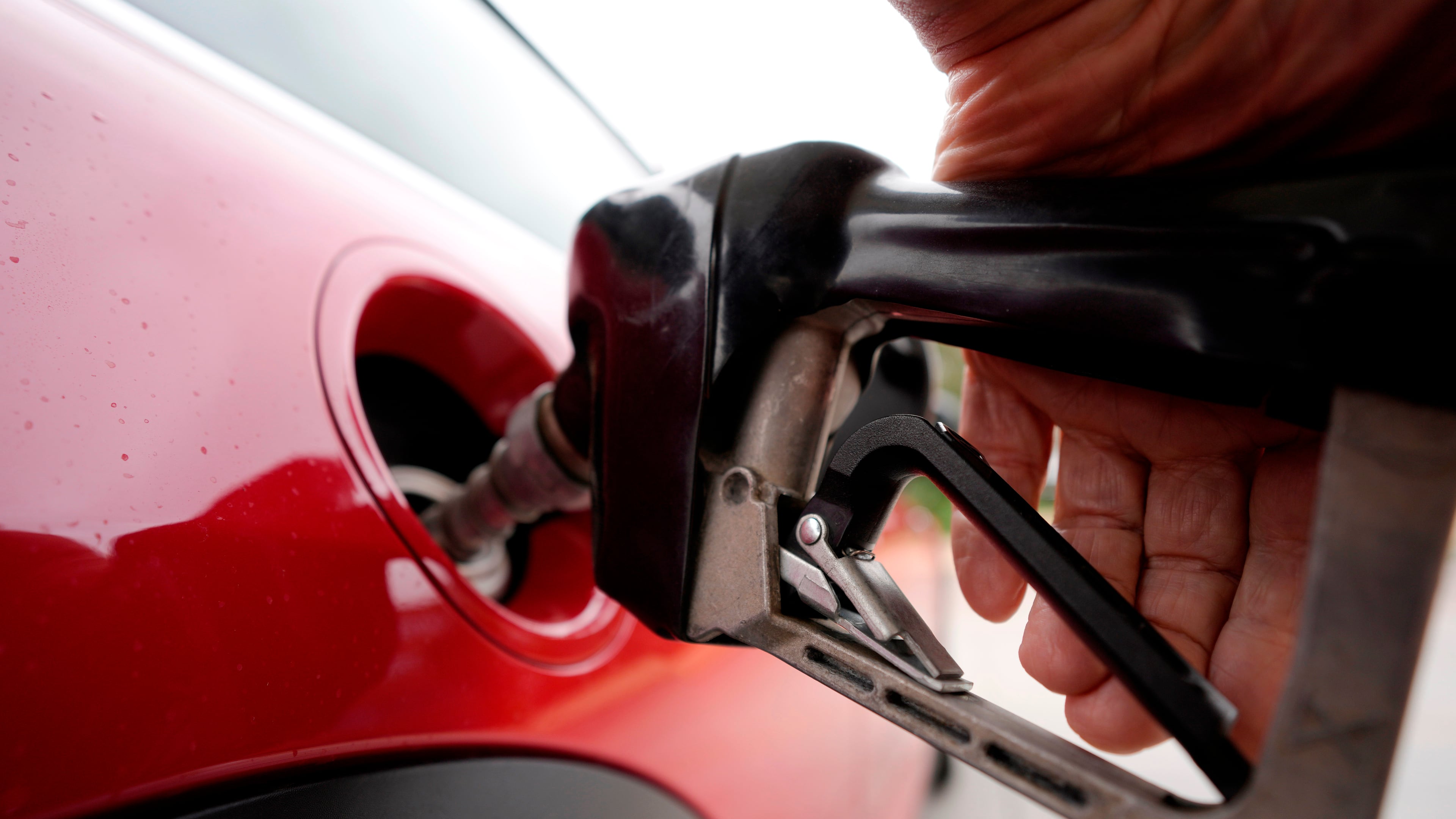 FILE - A motorist pumps fuel at a Shell station Wednesday, July 5, 2023, in Englewood, Colo. (AP Photo/David Zalubowski, File)