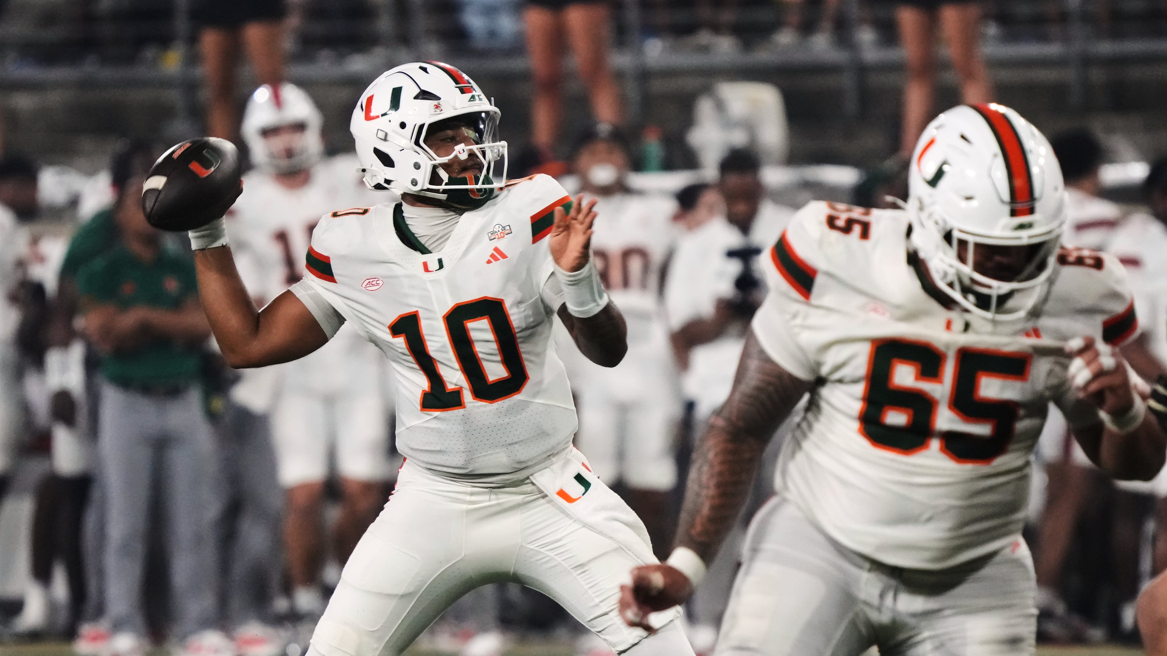 Miami quarterback Darian Mensah (10) looks to pass the ball against Wake Forest during the first half of an NCAA college football game in Winston-Salem, N.C., Friday, Sept. 18, 2026. (AP Photo/Chuck Burton)
