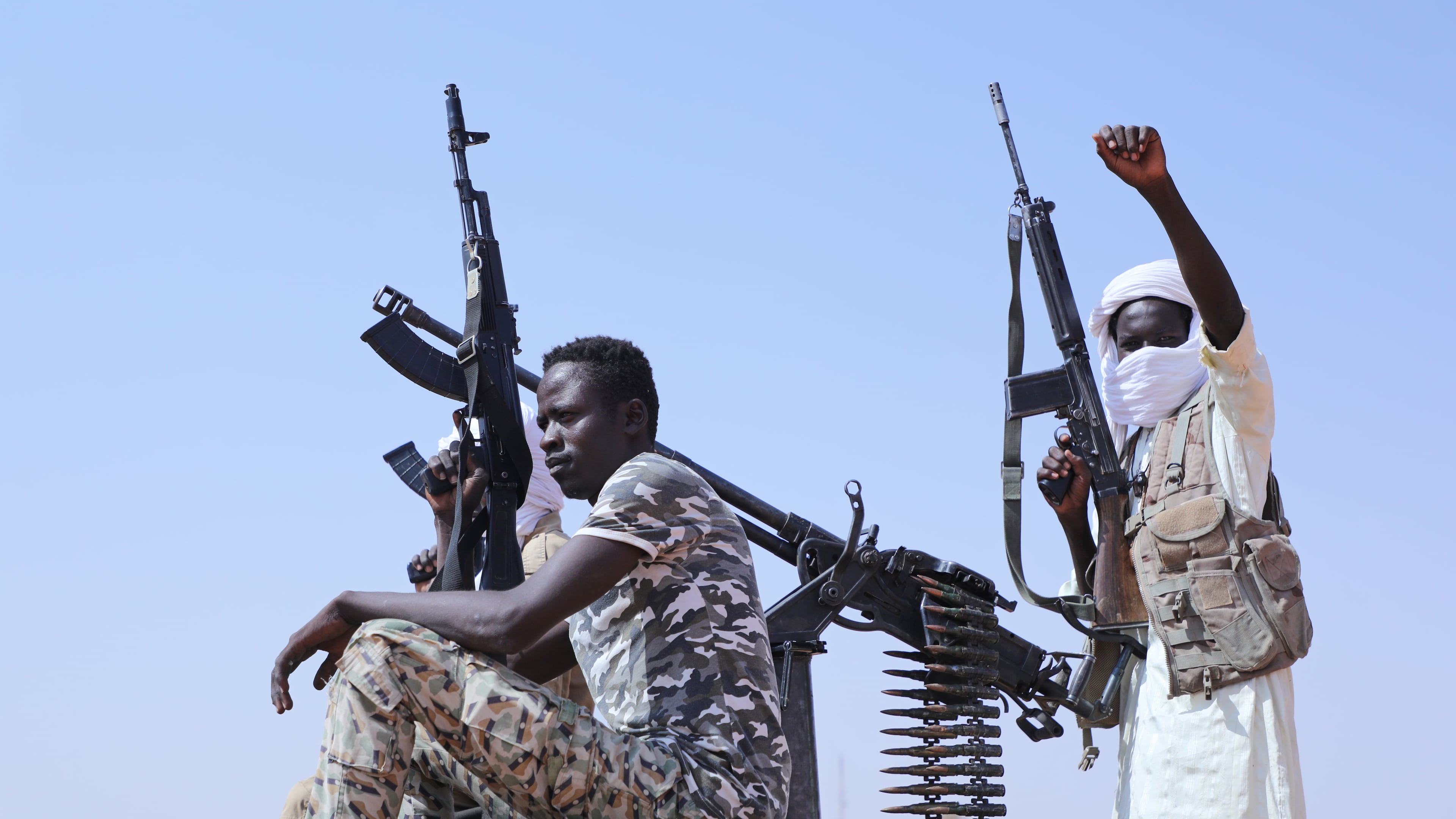 Fighters of armed defectors from the paramilitary Rapid Support Forces (RSF) celebrate, as they are believed to be surrendering to the Sudanese army, in the west of Omdurman, just outside Khartoum, Sudan, Wednesday, Aug. 19, 2026. (AP Photo/Mohnd Blal)