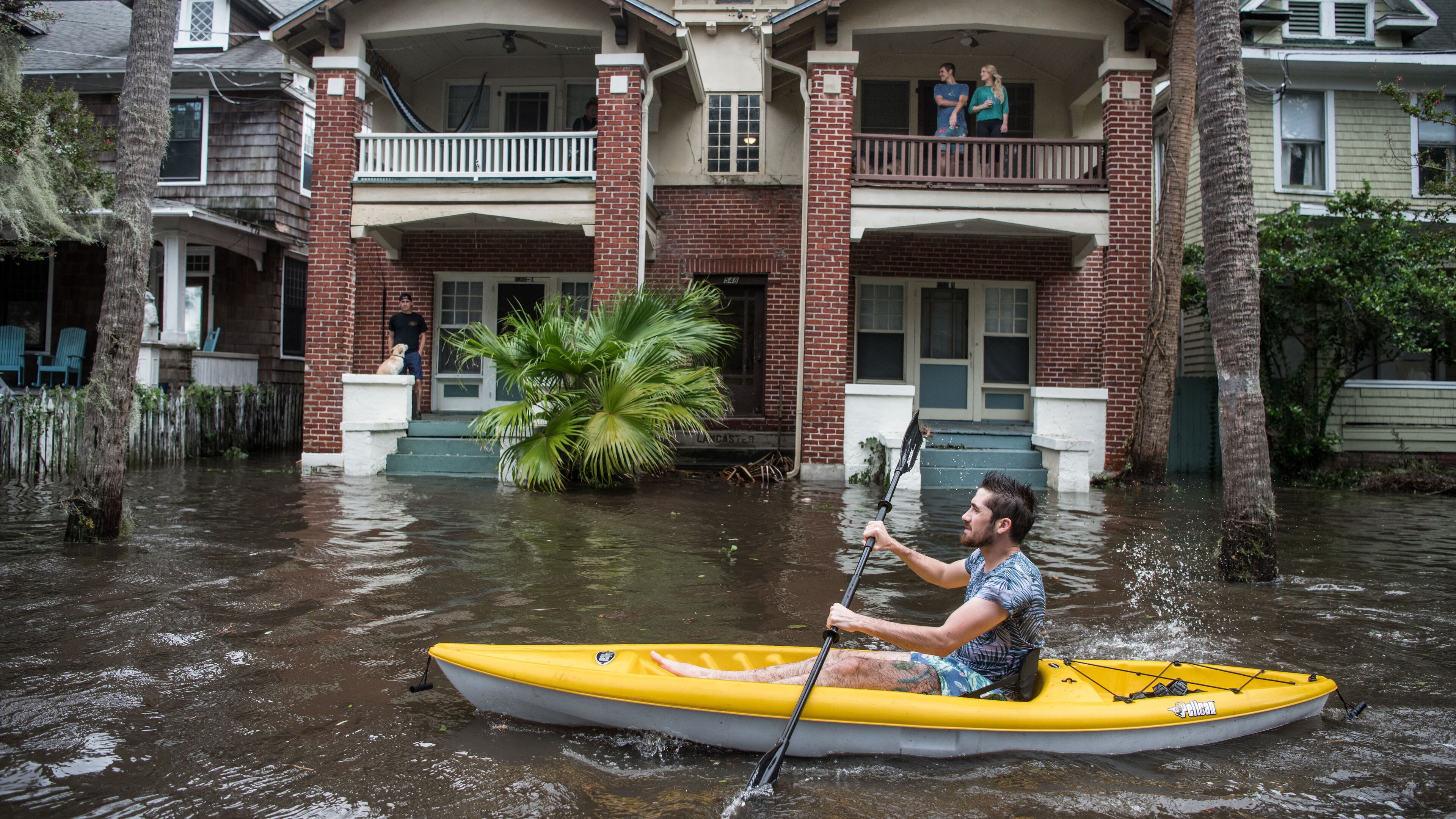 JACKSONVILLE, FL - SEPTEMBER 11: Justin Hand navigates storm surge flood waters from Hurricane Irma along the St. Johns River on Sept. 11, 2017 in Jacksonville, Florida. Flooding in downtown Jacksonville along the river topped a record set during Hurricane Dora in 1965. (Photo by Sean Rayford/Getty Images)