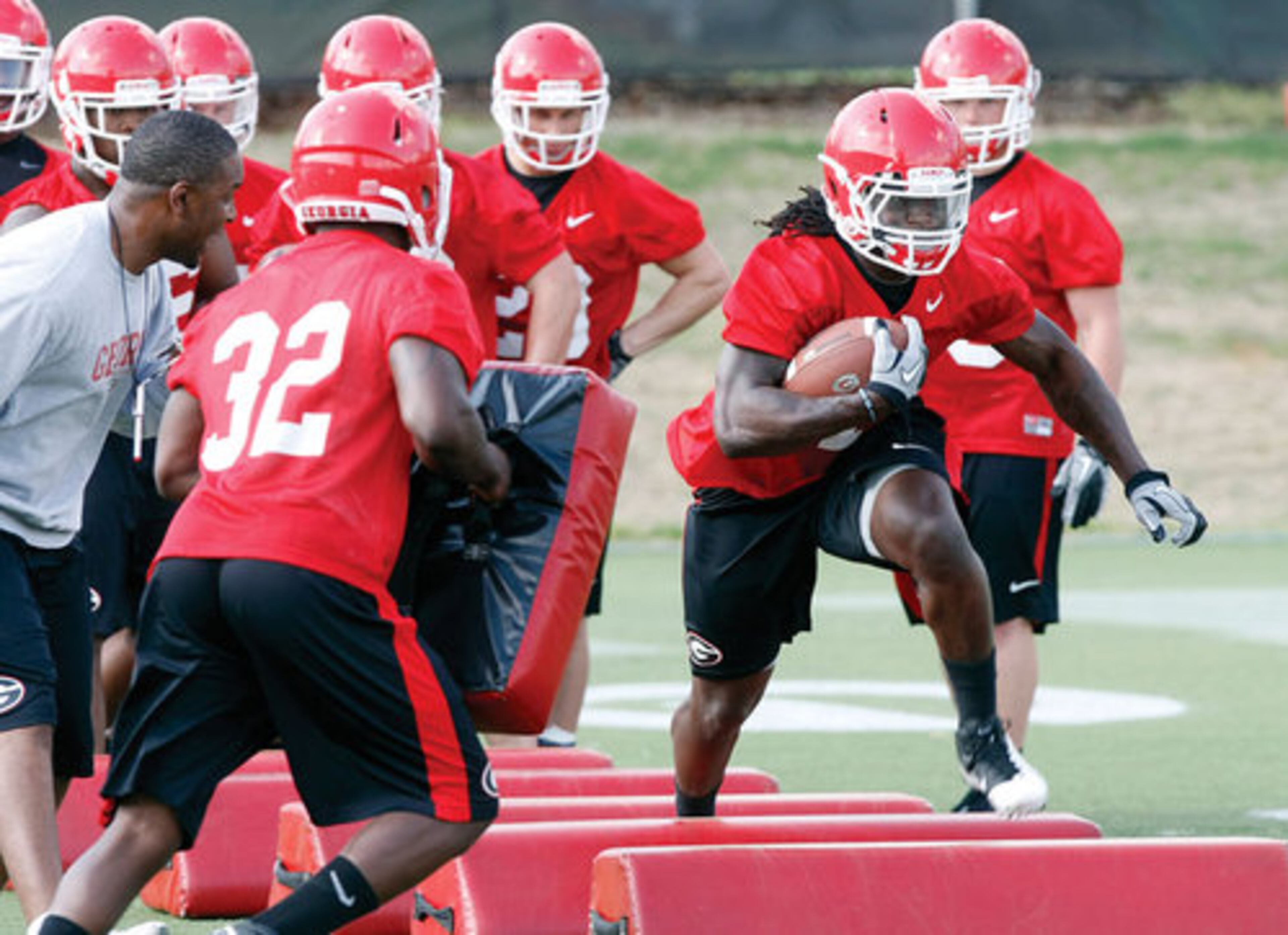 Isaiah Crowell is the first player through a foot drill on the first day of spring football practice in Athens on Tuesday, March 20, 2012.